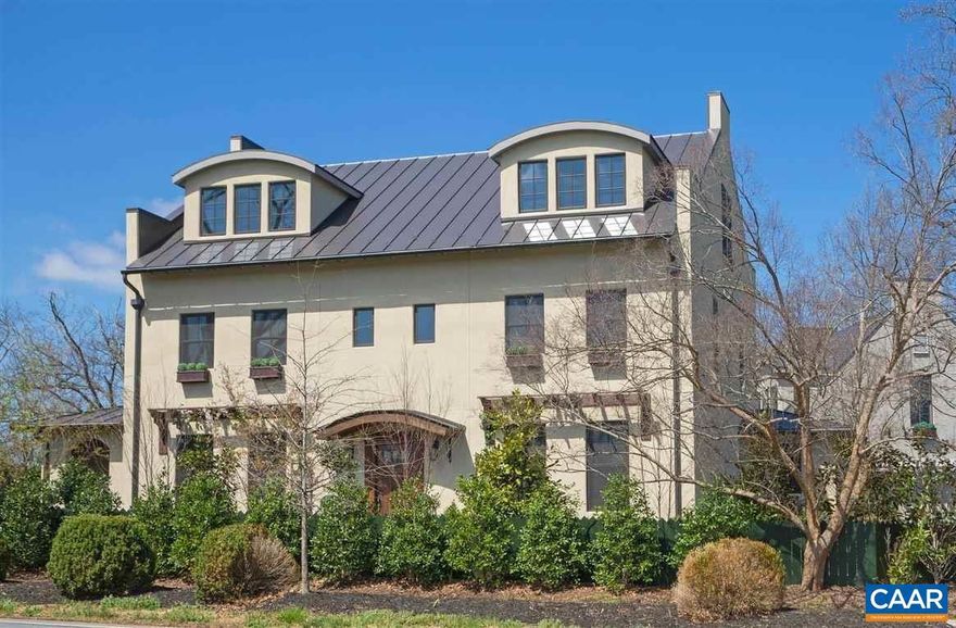 Walkable to most things UVA, including Jefferson's Rotunda and JPJ!!  This Unique Rugby Rd home offers Old World sophistication mixed with casual elegance.  Rustic elements, pristine landscaping, and timeless moldings all add to the warmth of this custom-built residence. Surprising mountain views and privately tucked away, this retreat boasts custom touches throughout for relaxing or entertaining. As you step inside, there is notable reclaimed flooring/countertops, graceful archways, hand forged and hammered antique copper hood, sinks and a farmhouse island.  Features inc Dacor 6 burner Gas Rangetop, wet bar, sunroom, and 1st floor br option.The primary BR/BA offers a steam shower, bidet and coffee bar. The walk out terrace level features a theater room, rec room, home office, exercise room, cedar closet and brick arched wine cellar. The FR stone masonry wood burning fireplace has a gas starter. Outdoor living inc a bluestone patio w pergola, wood burning fireplace and a cozy covered side porch. Two guest suites adjoin the 2 car garage w dog shower. A 2016 home that presents as a historic renovation.  Gated driveway entrance! Luxury Living and Gracious Entertaining on Historic Rugby Rd!,Cutting Board,Glass Front Cabinets,Granite Counter,Oak Cabinets,White Cabinets,Wood Counter,Exterior Fireplace,Fireplace in Great Room