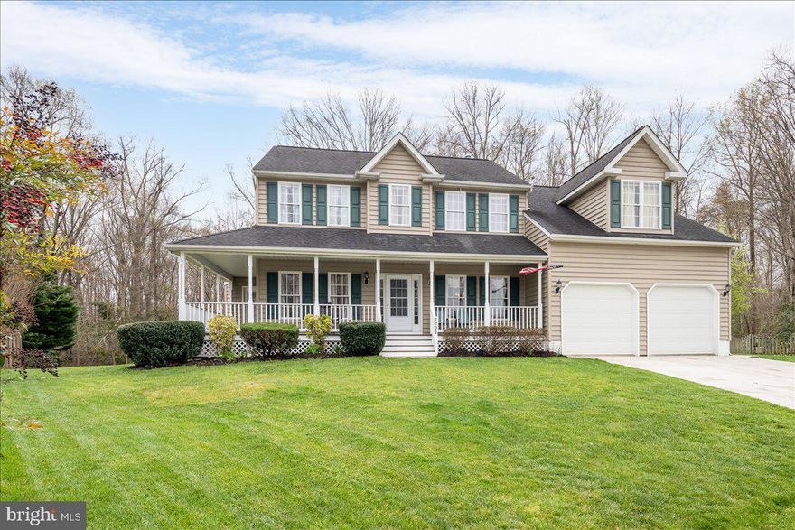 Stunning and fully updated colonial at the end of a cul-de-sac backing to battlefield – no future development!  Wrap-around front porch denotes immediate character as you enter the foyer with crown molding and chair railing accents over bamboo hardwood flooring.  Formal living room is to the left, while formal dining room is to the right.  Tastefully updated kitchen has granite countertops, stainless appliances, beautifully painted cabinetry, wood-style backsplash, and breakfast bar.  The breakfast bar adjoins a 12x7 bump out extension to the kitchen area with view of huge deck and awesome fenced back yard backing to trees, equipped with a basketball court, and a very large shed.  Also adjoining the kitchen is a hallway to the garage, which could function as a mud room!  It does function as a hallway opening onto first, a walk-in pantry!  (There is a smaller regular pantry, too, in the kitchen!)  Second, the hallway hosts entry to a large main floor bedroom and a full bath!  Flooring in the kitchen, hallway and Family Room is engineered wood, differing from but matching beautifully and offsetting the bamboo in the front rooms.  The Family Room is warmed by a gas fireplace and ventilated by a new ceiling fan…the many ceiling fans throughout the home are new.  Hardwood stairs ascend to upper level and breathtaking Primary Suite awaits!  Newly installed and painted shiplap accents wall under vaulted ceiling, ceiling fan, luxury vinyl plank flooring enters spa-like primary bath through barn door sliding entry, jewel like porcelain soaking tub is to one’s left, followed by a striking glass enclosed stall tiled shower, and WC.  To one’s right is an enormous walk-in closet!  (Guys, there’s room for you to share!)  Down the freshly carpeted hallway outside primary suite, are an 8x18 alcove, currently used as a sitting and computer area, along with four more large and commodious bedrooms.  Bedrooms are laminate wood flooring, and all have ceiling fans. Laundry room is on the upper level.  (Washer and Dryer do not convey.)  The basement is partially finished with a large great room or media room, a half bath, and huge amounts of storage room, along with a full workshop!  Welcome home!