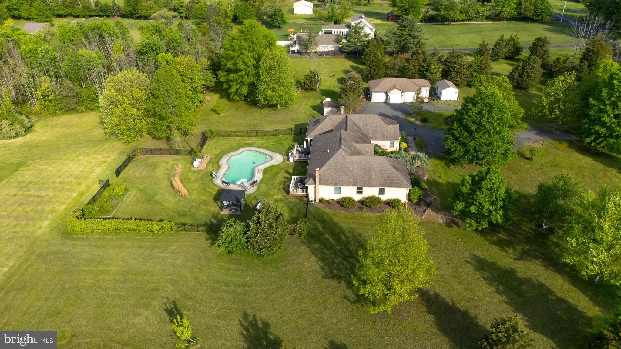 Custom Brick & Cedar Ranch on Nearly 8 Scenic Acres – A Private Paradise in Upper Perk School District
Welcome to your dream retreat! This custom-built, spacious brick and cedar ranch home is nestled on almost 8 picturesque acres, offering the perfect blend of comfort, elegance, and functionality in the sought-after Upper Perk School District. Step inside to a gracious entry foyer leading to a formal dining room, perfect for hosting family gatherings. The heart of the home is an expanded eat-in kitchen, featuring solid wood cabinetry, granite countertops, a large center island, and a generous dining area—ideal for everyday living and entertaining. The main level also boasts a cozy family room and a large home office or den, offering flexible living space. The owner’s suite provides a peaceful retreat with abundant closet space and a private full bath. On the opposite wing, you'll find four additional bedrooms and two more full bathrooms, ensuring plenty of space for family or guests. The lower level includes a recreation room, creating even more space for entertainment, hobbies, or relaxation. Also located in the lower level is the utility area containing the geo-thermal heating system, & air conditioning system! There is also a full house propane fired generator!
Step outside to your private oasis: enjoy two spacious decks, a patio, gazebo, and a luxurious in-ground Gunite pool—perfect for summer days and sunset evenings. A detached 4-car garage plus an additional garage provides space for 5 vehicles or ample storage for your hobbies and equipment.
Don’t miss this rare opportunity to own a slice of paradise—schedule your private tour today! Please click movie camera icon to see virtual and video tours!