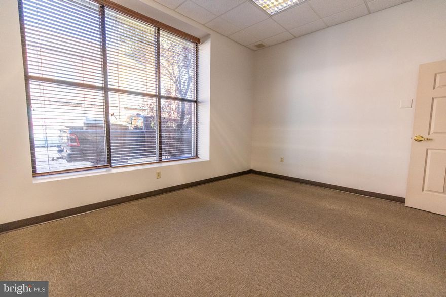 Welcome to Vandalia on Queen in Downtown Martinsburg’s Newest Professional Hub!
Located at 101 S. Queen St, this freshly reimagined office building offers multiple private offices for lease in the heart of downtown, just steps from shops, restaurants, the courthouse, and the city’s growing downtown district.

Each office includes high-speed internet, electric, water/sewer, and mail service, all wrapped into one simple monthly rate. Tenants also enjoy access to two shared conference rooms, a spacious break room, and thoughtfully updated common areas designed for comfort and productivity.

Need more than one office? No problem. Multiple spaces can be leased together for growing teams, small firms, or solo professionals who want a dedicated work area plus an additional meeting or admin space.

A private parking lot is located behind the building, and parking passes are available for just $30/month for tenants who prefer guaranteed off-street parking.

Whether you’re launching a new venture, expanding your footprint, or upgrading from a home office, Vandalia on Queen delivers an affordable, flexible, and modern workspace in a prime Martinsburg location.

Come be part of downtown’s next chapter. Offices are available now and secure your space today!