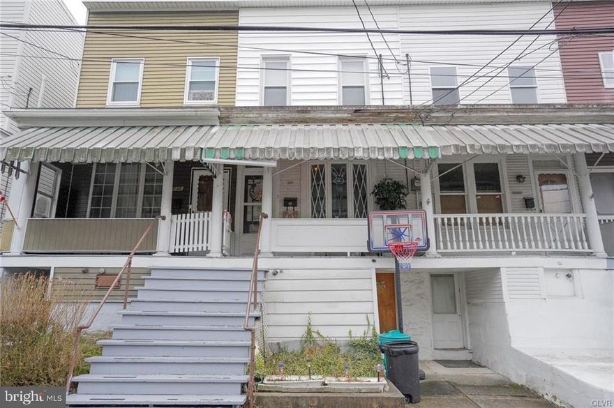 Tamaqua Mid-Row home sits near the edge of town, an awesome place to call home or add to your investment portfolio. A covered front porch leads to the homes main level with living room flowing effortlessly into the dining room and on to the spacious eat-in kitchen. The living room features 9’ ceilings and a bow window overlooking the porch. Upstairs bedrooms are served by the full bath. A covered patio, accessed via the kitchen, leads to the home’s yard which stretches to the street behind – across this street, lush Pennsylvania woodland! The basement offers full-walk out to the front of the home. The East End Park sits nearby and Tamaqua's ever-growing downtown a short walk away! Bonus, Tamaqua School District graduates qualify for the two-year LCCC Scholarship Program!