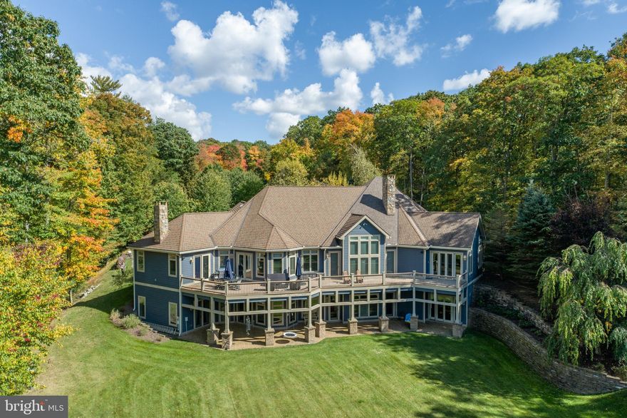 SANDY BEACH ESTATE PROPERTY.   The QUALITY of real estate begins with the LAND. Inherently, this exquisite parcel gives you 2.08 Acres with 150' Lakefront.  The residence has 9,134 sq. ft. of finished living space & 250 ft. of unfinished storage apace.  The ULTIMATE PRIVACY is felt as you drive up the tree-lined driveway.  Privacy screened from neighbors on left and right with mature Oaks and Pines.
Protection  from Stockslager Rd. simply because of parcel size has this residence at a great distance from the drivway entrance. This one-of-a-kind parcel is captured by the drone photos. TRULY a LAKEFRONT ESTATE.  Head on to the waterfront and see why Sandy Beach got its name.  True sand for your enjoyment. The natural curvature of the Lakefront has a mild inset onto an inlet (see photos).  This creates a haven tuckaway for your vessels and a nice, safe swimming area.  TYPE A Dock Permit for 2 Powerboats and PWC.  Boat Dock has built-in ramps for your PWC and is an EZ composite material. Lakeside Shed for all your accessories.  Bonfire Pit with Adirondacks for your evening enjoyment with the stars.  INTERIOR EXTRAS most homes do not have:  WINE CELLAR; ELEVATOR;  GENERATOR.  The elegant residence has a private Full Bath for every bedroom.  All Bedrooms are ample and large in dimension.  The Primary Suite on the main level has 2 separate sinks and bathroom dressers.  TOTAL of 3 En Suites on Main level and 2 En Suites on Lower Level.  Wine Cellar accessed through Lower Level Full Size bar that is wonderfully equipped with all the conveniences of entertaining & a 2nd Refrigerator.  Living Room with hardwood floors remains unfurnished for use as a ballroom dance floor.  There are two other areas for use as a living room space -  main level - off kitchen family room.  Lower level large Recreational Area with sectional accomodates a lot of seating.  Separated by wall with Game Room.  Kitchen with WOLF 6 burner gas stove - oven.  Sub-Zero Refrigerator. Granite countertops; walk-in pantry and breakfast bar.  Family Room with fireplace is so convenient.  Butler's Wine Alcove with wine refrigerator takes foot traffic away from the kitchen area. List Price includes $50,000  bedroom flooring allowance to freshen & update.  Well & Septic on File and property scheduled for connection to Public Water & Sewer at Seller's expense. 


US 219 to Stckslager Rd.   - follow to almost the end to Sandy Beach Community.  Home closer to entrance of Sandy Beach.  From McHenry Railey Office via Wisp mountain = 7.4 miles.  From Arrowhead Market via Mayhew Inn Rd. = 8 miles. Currently on Private Well & Septic.