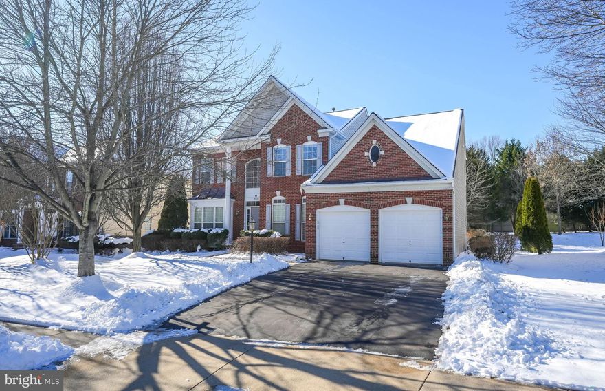 Coming Soon! Professional Photos to come! Welcome home to this Vanderbilt model in the sought after Westmarket community! This executive home with beautiful brick façade and extensive landscaping is sure to delight! Featuring a soaring two-story foyer with wood flooring and wide crown molding creating an elegant setting from the first moment you enter.  The centrally located dual- sided staircase, upper landing overlooking the foyer, and an abundance of windows give an airy and light filled atmosphere.   A formal sitting room with bumped out bay window and  formal dining room, adorned by a custom, contemporary crystal chandelier, wainscoting, crown molding and chair rail, provides a sophistication  for entertaining. The large kitchen has wrap around granite counters, a lighted walk-in pantry with custom glass door, double wall oven, huge island with gas cooktop, a chef's desk, and Butler's pantry all surrounded by custom maple cabinets. The breakfast nook has plenty of room for a table and overlooks the spacious family room, with gas fireplace and floor to ceiling windows. Just off the kitchen are French doors with glass enclosed mini blinds leading to the large 20x20 Trex deck with custom trellis, built-in benches and storage box.  An office/library tucked between the family room and a main level full bathroom, can be easily converted to a main level bedroom. The recently remolded first floor powder room was upgraded to a full bathroom with quartz vanity, custom porcelain tile, and a walk-in shower with tinted glass doors. A laundry/mud room with upgraded sink with large storage drawer and second pantry round out the ground floor. Upstairs, the gracious primary suite has a lighted ceiling fan, oversized windows, and a step down sitting area with room for a sofa or treadmill, dual walk-in closets, and a en suite bathroom with soaking tub, shower, and dual vanity provide a true owner's retreat. Across the hall is a large, front facing 2nd bedroom with walk-in closet and ceiling fan. Down the wide hallway are 2 additional well appointed bedrooms and a full hall bathroom.  The lower level has a finished basement with a huge recreational room with crown molding, chair railing, and custom built-ins, a kitchenette with tile flooring, Stainless Steel french door refrigerator, dishwasher, microwave oven, and plenty of cabinets and counter space, 2 large bonus rooms and a full bathroom with jetted tub! Community amenities include an outdoor pool, playground and sport courts, and close proximity to the local library.  Route 15, I-66, and Rte. 29, provide easy access for commuters.  Close to historical sites, wineries/breweries, golfing, parklands. shopping, dining and so much more!