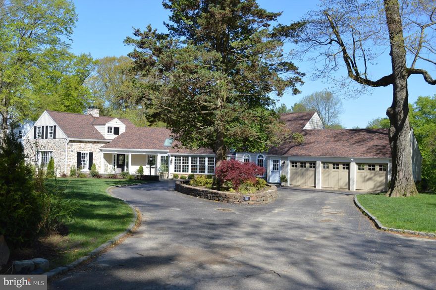 Anything but a traditional center hall colonial BUT if unique, private,  comfortable, great spaces and grounds appeals to you pay us a visit.  Professionally Landscaped Grounds - Grand Views   Privacy   First Floor Master. This stunning 2-acre property is protected on two sides by more than 14 acres of neighboring land conserved against development under the Natural Lands Trust. The residence boasts generous and very private ground in both front and back set back from the road several hundred yards. Given the space in the rear it offers a great opportunity to add a pool or tennis court.The unique and recently renovated house sits at the end of a long cobblestone-lined circular driveway embracing a tree and shrub center aisle. In addition to the 3 car garage a two space side parking area is available for visitors. Access to the house may be gained by one of 3 entrances two of which are off a lovely front stone floor patio surrounded with a matching 24  stone wall. The house has a new roof and new skylights throughout, a new chimney and chimney liner.The master bedroom is on the first floor in the west wing. In addition to a generous master, a second smaller bedroom was created in this wing with the intent to serve as a young child s bedroom or the creation of a walk-in closet. Both spaces have full baths.Moving east you will pass through a spacious and light filled family room facing the rear and an equally generous bright dining room facing the front. The 1st fireplace is in the latter. From the family room a staircase leads to two large bedrooms and a full Jack-and-Jill bath: one facing front, the other to the rear.The next space in the center of the home is the kitchen. The eat-in kitchen features off white painted cabinetry, granite counters, granite island, stainless appliances, (Sub-Zero fridge, Miele dishwasher, Thermador double-ovens) and a heated tile floor. There are 2 unique spaces open to the kitchen facing the rear, one currently used as the eat in section of the kitchen, the other an informal family room with the 2nd fireplace and heated floor. A generous and convenient walk-in pantry with a washer/dryer completes the kitchen. Leaving the kitchen moving east through a wide foyer one passes a large hall closet and next a powder room. One can hardly miss the presence of light throughout: a delightful recurring feature. The front of the foyer is lined with nee wall to ceiling windows.To the rear of the foyer at the very east end are two interesting spaces, both currently serving as offices. The former owner created a guest or au pair suite. The first floor served as the family room with the 3rd fireplace and efficiency kitchen with a bedroom and full bath and stackable laundry above on the 2nd floor From this last living space one can access the 3-car garage, all with overhead door motors, extra deep with storage above.The property is landscaped throughout, and the rear view is enjoyed from a new slate patio, fenced whose double wide gate leads down 4 rose bush lined steps.Here are some additional features to consider: exterior sprinkler system-oversized gas line to house- public water- on site septic (which has been recently renovated and enlarged), but neighbors have connected to public   exterior light system - award-winning Radnor Township schools  - easy access to Main Line shops and dining plus all major transportation routes - only one mile to Bryn Mawr Hospital: Added benefit: Stroll across the street to Coopertown Park for tennis and basketball courts, along with a baseball diamond and a playground. The Coopertown Neighborhood Association is very active and even though the homes on the west side of Highland (like 340) are in Radnor Township and the school is in Haverford Township, the Association is very inclusive.