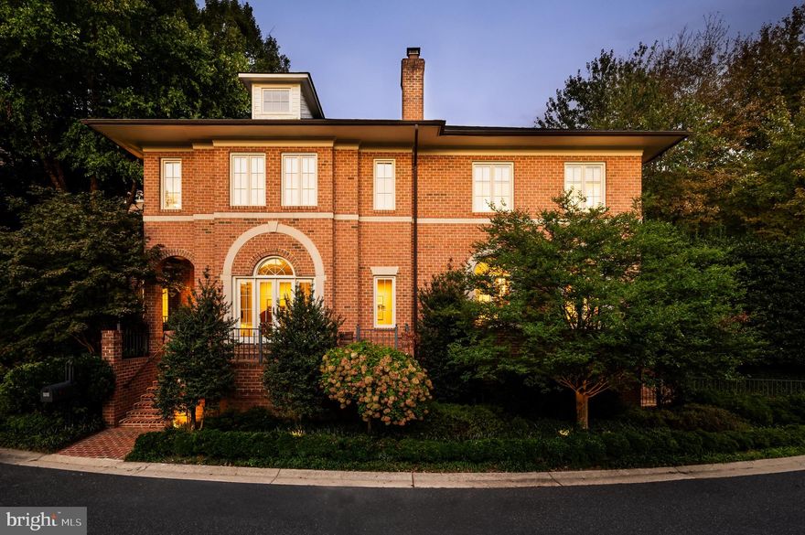 Synonymous with quiet luxury and understated elegance, Kemble Place is one of Washington’s most sought-after private enclaves. Nestled within this exclusive community, 4814 Kemble Place occupies a rare double lot, (encompassing both 4814 and 4816 Kemble Place)  creating a private  outdoor oasis that includes a pool, pool house and separate studio/guest house and office. The residence is an update on classic architecture, blending timeless principles with modern livability. Its façade nods to the grand estates of the past while incorporating contemporary elements, creating an unmistakable presence.  A dramatic, offset entry introduces the home through a transverse limestone gallery, where a formal powder room and coat closet are discreetly tucked away. Natural light pours into the living spaces through elegant casement windows, highlighting substantial millwork and thoughtful architectural detailing. The sweeping custom designed staircase, floating above a dramatic picture window, aligns beautifully with the formal living room.   Anchored by an English limestone fireplace and framed by a balcony overlooking the streetscape, it exudes both scale and refinement. Adjacent, the stately dining room flows into a bay-windowed breakfast room with built-in cabinetry, connecting to the kitchen.  At the heart of the expansive grounds behind the main residence is a 40’ X 20’ pool with integrated spa, finished in bluestone and equipped with an automatic cover. The adjacent pool house opens via NanaWall to an al fresco lounge and long wet bar and features a full bath, garden shed and work room.  A separate guest house with kitchenette and full bath separated from the pool house by double pergola covered terraces complete the private retreat—one that belies the home’s close-in location.  Wine cellar, gym & steam shower are just a few of the special amenities.  Minutes from Georgetown, Downtown, and major commuter routes, 4814 Kemble Place stands as an exemplary residence at the pinnacle of Washington living.