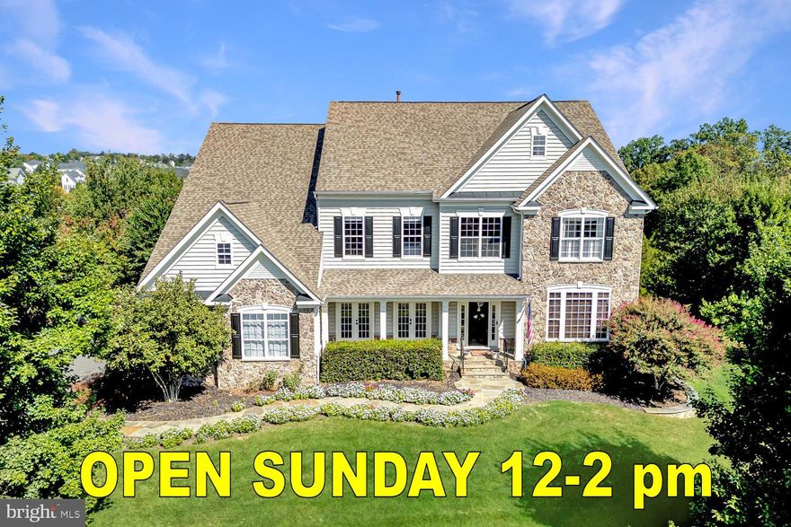 An exceptional opportunity to own one of the finest homes currently available in The Park at Belle Terra. This impressive executive residence offers more than 5,700 square feet of beautifully appointed living space with five bedrooms and four and a half bathrooms, all set on a picturesque ¾ acre lot backing to community open space with scenic views.
<br><br>
The home immediately impresses with striking curb appeal including a stone front exterior, landscaped walkway, welcoming covered porch, and a side-load three-car garage. Inside, the grand two-story foyer showcases elegant trim work, decorative columns, neutral tones, and a sweeping curved staircase. Rich wood flooring enhances much of the main level, creating a warm and refined setting.
<br><br>
The thoughtfully designed main level offers a balance of elegance and functionality with a formal dining room featuring a tray ceiling and detailed moldings, a bright living room with French doors that open to the front porch, and a private study with custom built-ins and glass French doors. The inviting family room includes plush carpeting, a gas fireplace, and access to the screened porch, providing a comfortable space for gathering and relaxation.
<br><br>
The gourmet kitchen is designed to impress with high-end appliances, quartz countertops, subway tile backsplash, a large center island with pendant lighting, and abundant workspace and cabinetry. A sun-filled breakfast area leads directly to the rear deck, making indoor and outdoor entertaining effortless.
<br><br>
Upstairs, the expansive primary suite offers a peaceful retreat with large windows, a spacious sitting area, and a convenient bar with mini refrigerator. The luxurious bathroom features a soaking tub, walk-in shower, and dual walk-in closets with custom storage solutions. Additional bedrooms are generously sized with plush carpeting and walk-in closets. One bedroom includes a private ensuite bath, while two others share a well-designed Jack and Jill bathroom. A convenient upper-level laundry room with utility sink adds everyday practicality.
<br><br>
The walk-out lower level includes a private au pair or in-law suite complete with a bedroom and full bathroom, along with ample unfinished space ready to be customized to suit future needs.
<br><br>
Outdoor living spaces make this property truly special. The cathedral ceiling screened porch features surround sound and ceiling fans, while the large deck overlooks a fenced backyard ideal for entertaining or relaxing. The patio includes a fully equipped outdoor kitchen with built-in grill, exterior refrigerator, and a stone bar, creating a perfect setting for gatherings or quiet evenings outdoors.
<br><br>
This remarkable property combines space, elegance, and a beautiful natural setting within one of the area’s most desirable communities.