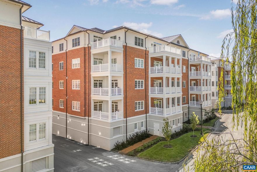 Immaculate condominium in the newly completed White Gables II, finished in 2024. This west-facing residence is filled with naturall ight and features an open floor plan with two porches for seamless indoor-outdoor living. Over $45,000 in upgrades include wide-plank hardwood floors throughout, Bosch appliances, and premium lighting and hardware selections. The home features 10? ceilings with crown molding, and designer fixtures highlight the entry, dining area, and kitchen. French doors from the kitchen and living room open to a covered porch showcasing northwestern views of the Blue Ridge Mountains and a glimpse of the Farmington Country Club golf course. A second private porch, accessed through the primary bathroom, offers an additional retreat. Spacious, spa-like ensuite baths enhance the home?s refined style. A versatile den with French doors provides flexible living space for an office, guest room, or media area. Two assigned parking spaces and a private storage area are located in the ground floor garage, with convenient elevator access directly to the first floor.