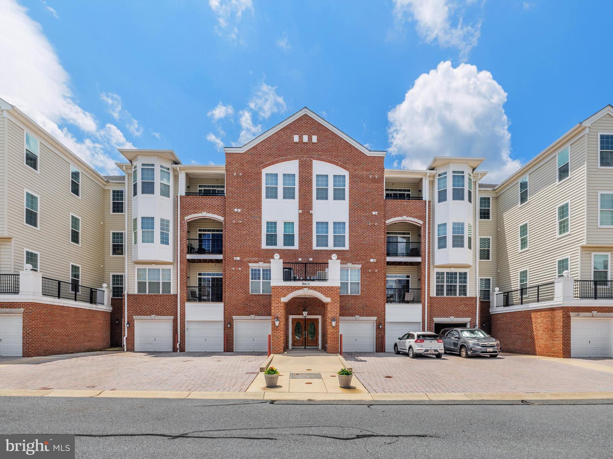 Welcome to Cedar Ridge at Piney Orchard — an active 55+ community offering comfort, convenience, and a lot of wonderful amenities. This bright and well maintained top-floor 2 bedroom and den, 2 full bath Condo is located in a secure, elevator-access building and includes its own private one-car garage with a tandem parking space.
Enjoy tranquil views from your covered balcony, which overlooks a lush, tree-lined common area — perfect for morning coffee or relaxing evenings.
Inside, you'll find spacious living areas, including a welcoming foyer, a den or home office space, a well-equipped kitchen with 42" cabinetry and white appliances, and a dining area that opens to the living room with a tray ceiling and ceiling fan. The generously sized primary suite features a sitting area, elegant columns, dual closets — including a walk-in with custom organizers — and an ensuite bath with a double vanity, large tiled shower with bench seating, and ample storage.
A second bedroom offers its own walk-in closet and easy access to the full hall bath. The laundry/utility room includes a full-size washer and dryer, along with additional shelving. Newer HVAC and water heater installed.
Residents of Cedar Ridge enjoy exclusive access to a private clubhouse, fitness center, outdoor pool, tennis, and bocce ball courts. You'll also benefit from all of Piney Orchard's extensive amenities — indoor pool, walking trails, lakes, community events, and more — plus nearby shopping and dining.
This is an excellent opportunity to own a well-kept, low-maintenance home in one of the area's most desirable active adult communities.