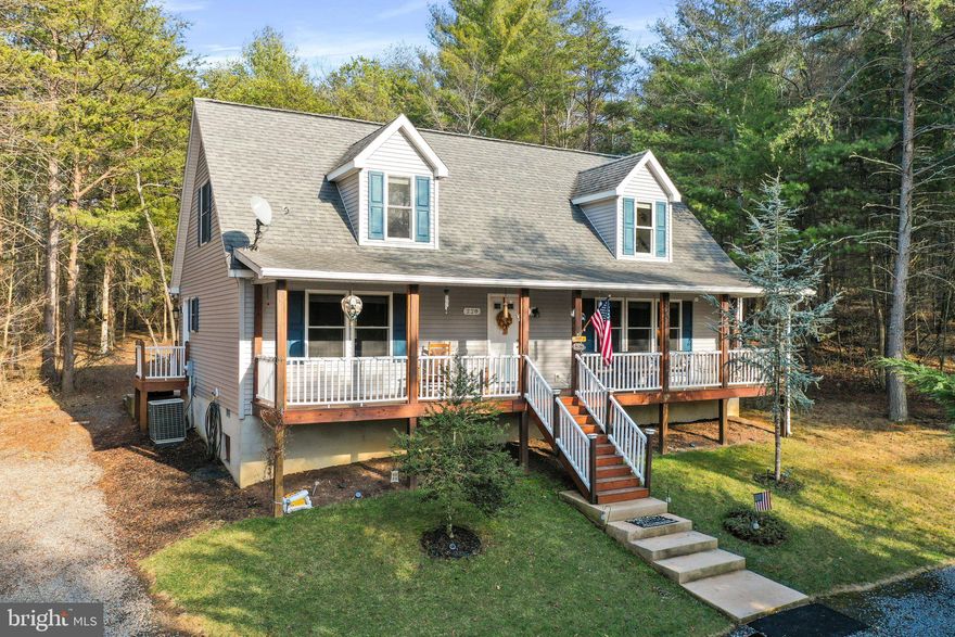 Nestled in the serene landscape of Bryce Mountain, 228 Sandpiper Dr, Basye, VA 22810 welcomes you to a charming Cape Cod home that offers a perfect blend of comfort and luxury.

Discover a tranquil setting close to resort amenities yet far enough to relish the peace and tranquility of the area. Enjoy the fresh mountain air on the covered front porch or unwind on the rear patio, complete with an 8 person hot tub for ultimate relaxation.

Inside, you'll find 3 bedrooms and 3 bathrooms, offering ample space for family and guests. The large eat-in kitchen with an island is perfect for culinary enthusiasts, while the living room with a cozy gas fireplace sets the mood for relaxation.

The main level primary bedroom features an oversized shower bath, providing a luxurious retreat within your own home. Upstairs, a versatile space awaits, perfect for use as a media or game room, ideal for entertaining guests or unwinding after a long day.

Embrace the beauty of Bryce Mountain living at 228 Sandpiper Dr. Schedule a viewing today and make this captivating property your own.