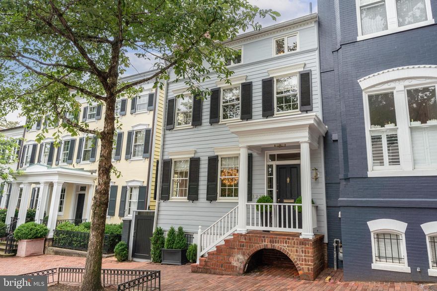 This elegant 5-bedroom, 3 full and 2 half-bath semi-detached residence in Georgetown seamlessly blends timeless architecture with thoughtful updates. Over the past five years, the current owners have completed key structural improvements and transformed the deep rear garden into a professionally designed, private retreat. With both southern and western exposures, the garden is bathed in sunlight and features multiple terraces, mature landscaping, and a tranquil water feature—perfect for outdoor entertaining or peaceful reflection.
The main level offers a gracious foyer, a spacious double living room with two fireplaces, an expansive dining room with a wall of glass overlooking the garden, and a bright, table-space kitchen with stainless steel appliances and French doors opening to the terrace. A powder room completes this level.
Upstairs, the second floor includes a generous primary suite with an ensuite bath and sitting area, along with two additional bedrooms and a hall bath. The third floor offers two more bedrooms and another full bath. The lower level provides a half bath, laundry area, utility room, and ample storage space.
A rare opportunity to own a classic Georgetown home with exceptional indoor-outdoor living and a sun-drenched garden setting.