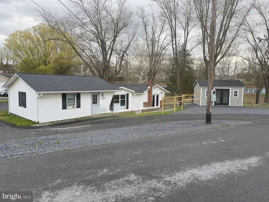 Income-Producing Mixed-Use Property in Fast-Growing Berkeley County, WV!  .36-acre residential/commercial lot featuring a renovated 1,309 SF duplex and two established commercial tenants. Duplex includes a 2BR/1.5BA and 1BR/1BA unit, renovated LIKE NEW in 2024/2025 to include paint, flooring, baths, kitchen, plumbing, electrical, insulation, floor joists and sub flooring. In addition, the main water line was replaced and a foundation company installed a water diversion system with a lifetime warranty. Both units are month-to-month, offering rent growth potential. Commercial frontage on Middleway Pike is leased to an established car dealer on a 2-year lease. Rear frontage on Cheshire Rd. is occupied by the current owner’s auto dealership with an 8-year lease requirement. Gravel parking pad accommodates 4 vehicles for duplex tenant parking, 10 spaces for front auto dealer, and 11 spaces for rear auto tenant. Property generates  $3,800/month in gross income across four leases. Located in Berkeley County, WV, recognized as the fastest-growing county in the state, with close proximity (25 min) to Loudoun County, VA, the nation’s wealthiest county. The property benefits from strong population growth, increased demand, and a comparatively high concentration of above-average income households… further enhancing long term appreciation potential and tenant demand. Ideal opportunity for investors seeking stable income with future upside.