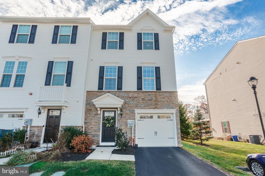 Welcome to this bright, modern end-unit townhome offering three levels of stylish, low-maintenance living in desirable Wyncote. Built in 2017 and exceptionally well maintained, this 3-bedroom, 2.5-bath home features 2,040 square feet of contemporary comfort, an open layout, and sought-after community amenities.
The exterior showcases a stacked stone and siding façade and a convenient one-car garage. Inside, the main and upper levels feature hardwood flooring, neutral paint, recessed lighting, and an airy flow throughout. The open-concept kitchen, dining, and living areas create a natural gathering space, with a large kitchen island offering bar seating, modern fixtures, a seven speaker surround sound system, and access to a sunny second-floor deck overlooking open space - perfect for morning coffee or outdoor dining. Upstairs, you’ll find three spacious bedrooms, including a serene primary suite with a tray ceiling, generous walk-in closet, and a spa-like ensuite bath with a double vanity and soaking tub. A full hall bath and convenient second-floor laundry complete this level. The walkout lower level provides bright, flexible finished space that can be tailored to your needs - whether for work, entertainment, fitness, or additional storage. Located in Wyncote, you'll enjoy easy access to Center City Philadelphia, major commuter routes, regional rail, parks, shops, and local dining - all while benefiting from a peaceful residential setting. Community amenities include a jogging/walking path, clubhouse, security gate, snow removal on common grounds, and lawn maintenance - allowing for truly effortless living. Modern, clean, bright, and move-in ready, this end-unit townhome offers the perfect blend of comfort, convenience, and contemporary style.