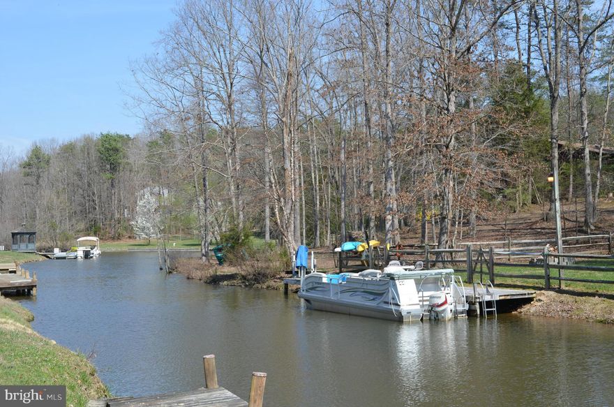 WATERFRNT Ramb w/WO InLaw Suite Renovated & Expanded in 2013.Gorgeous 4"plank woods floors Loaded 5+ BAY Gar w/heat/AC Great 4 Home Biz Park12+cars Relaxing 2 tiered deck(32X9above24X16) w/Hot Tub off MSB FirePit, Koi Pond off Kitchen Overlooks Quiet Cove! EZ to maintain landscapin w/3 sheds w/elec 60' boat dock w/jet ski lift 141' of waterfrnt,front&back fenced, comm beach & boat ramp nearby