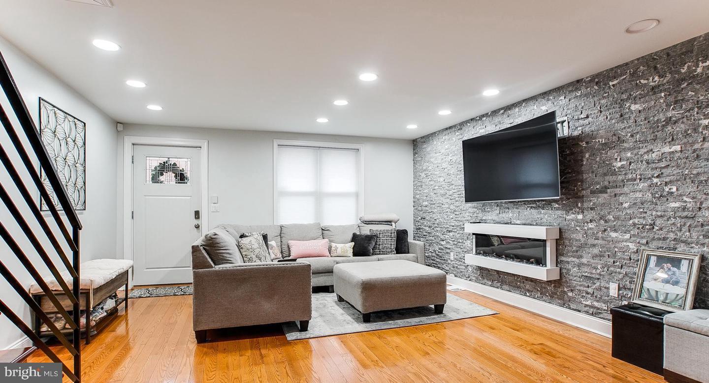 Welcome to 1846 E Hazzard Street—where comfort, style, and city living come together just minutes from the heart of Fishtown. This beautifully updated 3-bedroom, 2-bath home offers the perfect blend of modern finishes and warm touches, creating an inviting space you’ll be proud to call your own. Step into the bright, open-concept living area with rich hardwood floors, recessed lighting, and a stunning feature wall with an electric fireplace—perfect for cozy nights in or entertaining guests. The heart of the home is the chef’s kitchen, complete with a granite island that comfortably seats six, stainless steel appliances, and plenty of cabinet space. French doors off the kitchen lead to a charming private patio, your new favorite place for coffee, cocktails, and quiet mornings. Upstairs, you'll find generously sized bedrooms with great natural light, including a serene nursery ready for your little one or perfect for a home office. The fully finished basement offers endless possibilities: playroom, gym, guest space, or media den—whatever your lifestyle needs. Tucked on a quiet block with friendly neighbors, you’re just steps from popular restaurants, coffee shops, and public transit. Whether you're a first-time buyer or simply craving connection and convenience, this move-in ready home delivers. Your new chapter starts here, schedule your showing today!