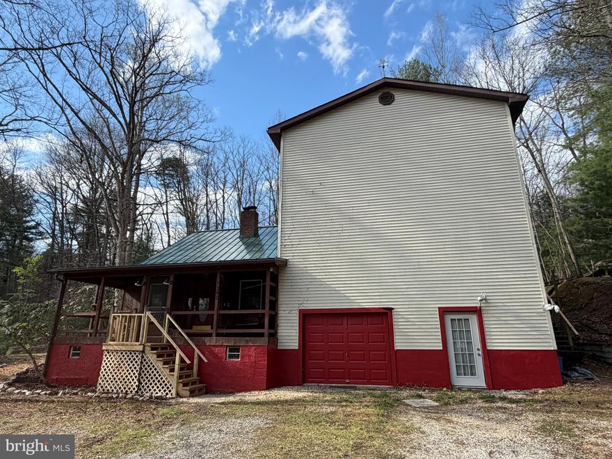 SECLUDED RUSTIC HOME ON 12.88+/- WOODED ACRES! Ready for a new owner to make it their own. Possible Family Retreat/Compound with 2 homes on Mountain Ground. Located adjacent to Michaux State Forest & Game Lands! Unique 2316 SF,  2 story home PLUS a 1 BR, 1BA, Log Cabin! The main house has a huge 2 story open room originally used as a Basketball Court! This could be a great "Game Room" for all! The front covered porch leads to the open living room with fireplace/pellet stove & vaulted ceiling. The balcony on 2nd floor leads to a full bath & 2 bedrooms. Wood flooring throughout & wood walls. The kitchen has a vinyl tile floor, plus a pantry in the laundry room. Beyond the kitchen is a family room with 2nd pellet stove. Off the family room you'll find the primary bedroom & bath on first floor. Plus a hidden stairway to a bonus room on the 2nd floor with wood floor, walls & ceiling. Walls need some finishing. French doors open to upper level deck. This property is being sold AS-IS. There are 3 parcels deeded separately, included in this sale.  MORE PICTURES COMING.
