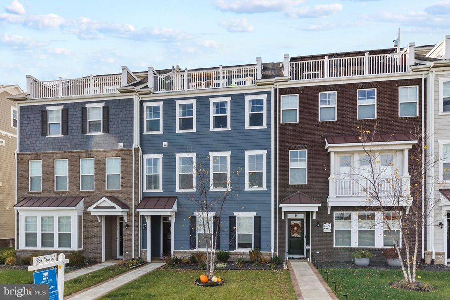 ***PRICE REDUCED***
Welcome to luxury living in the highly sought-after community of Potomac Shores! This stunning 4-story townhouse offers modern design, spacious living, and resort-style amenities right at your doorstep. 
Featuring luxury vinyl plank flooring, the main level boasts a gourmet kitchen complete with stainless steel appliances, a gas cooktop, double oven, and a large entertainer’s island that flows seamlessly into the dining and living areas. Enjoy your morning coffee or evening grilling on the deck conveniently located off the kitchen.

The lower level offers versatility with an office space, flex room, and convenient drop zone, ideal for today’s lifestyle. Upstairs, you’ll find three generously sized bedrooms, including a serene primary suite with a spacious walk-in closet and a spa-like ensuite bathroom.

The fourth floor is an entertainer’s dream—featuring additional flex space currently used as a movie theater, plus a walkout rooftop terrace designed for relaxation and hosting unforgettable gatherings.
Additional highlights include a two-car garage, a driveway with space for two more vehicles, and plenty of storage throughout.

Located in the vibrant Potomac Shores community, enjoy access to two pools, a social barn, sports complex, community schools, scenic trails, and the prestigious Jack Nicklaus Signature Golf Course.