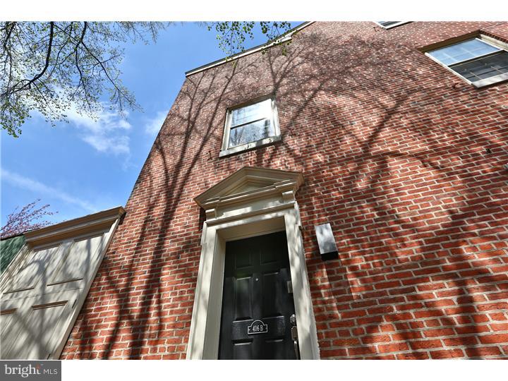Set back on a beautiful and quiet cobblestone street, this lovely condo located in the heart of historic Society Hill is a rare opportunity! Enter through a private entrance on Stampers Street (which has a front door view of the beloved Society Hill Shambles!) and into a home with high, vaulted ceilings and handsome hardwood flooring throughout. A spacious and open living area features a woodburning fireplace and plenty of natural light, and leads into a dining room complimented by exposed brick. The kitchen features soapstone countertops, modern cabinetry, and shining stainless steel appliances. A large raised deck offers more living space and a beautiful view, making it the perfect place to enjoy your morning cup of coffee or dinner with friends. The first bedroom is located at the rear of the main floor, and features plenty of closet space and a full ceramic-tiled bathroom. Upstairs, you'll find a master bedroom that boasts exposed brick, plenty of built-in closet space, and its own tiled ensuite bathroom. Located next to the entrance to a gorgeous community courtyard and steps away from some of the most popular coffee shops, restaurants, and bars like Bodhi Coffee, Pizzeria Stella, and Ela as well as close proximity to public transportation and Delaware Ave.