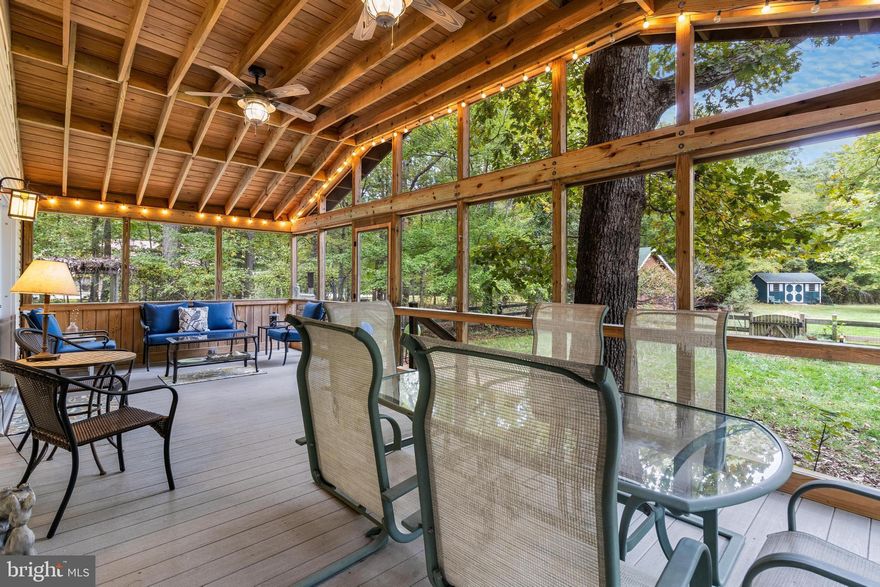 This is your chance to own a well-maintained and upgraded home with a focus on energy efficiency and modern amenities.  The wrap-around front porch adds charm and outdoor seating options, and the fenced-in yard is perfect for pets and offers a safe and private outdoor space.  The architecturally designed sunroom is an inviting and comfortable space year-round with ceramic clay tile flooring, expansive double-paned windows for natural lighting, a high-efficiency wood-burning stove, and passive solar heating/cooling.
The kitchen features stainless steel appliances, butcher block counters, a kitchen island for extra workspace, and built-in cabinetry, which can contribute to a more modern and functional kitchen.
New carpeting was installed in 2020. The primary bedroom on the main level was newly configured, and a walk-in closet was added, improving the layout and functionality of the space.  The primary bathroom was updated with a walk-in shower, enhancing the comfort and aesthetics of the primary suite. The primary bedroom and art room, feature luxury vinyl plank flooring, which is durable and stylish.  There are new washer and dryer units in the laundry room.
The 30'x12' enclosed back porch is the perfect place to enjoy outdoor relaxation and entertainment with a vaulted ceiling, dual ceiling fans, and beautiful lighting and is a valuable addition.
Two sheds, the Amish 10'x16' shed features windows and loft storage and the second custom built shed with a concrete floor, electric, and additional loft space, offers even more storage capacity and versatility making them a practical and aesthetically pleasing outdoor storage space. The 3 acre property boasts fruit trees, mature trees, yard space, and room for gardens, which can provide both aesthetics and functionality.
The 26'x40' detached garage with 10' overhangs on each side and double 9'x8' garage doors provides ample space for parking and storage. and includes an attached 22'x26' conditioned shop with heat, electric, and plumbing for water and septic offers a versatile space for hobbies or work.
The garage also features an interior access door with steps to the second-floor loft/storage space and is a valuable addition for storage or potential use as an accessory dwelling unit (ADU). The garage has vertical vinyl siding, custom windows, a blue stone, and a 10'x16' concrete pad for additional functionality. The property also features a 30-year engineered architectural roof and a gravel drive from the main driveway to the garage.
Overall, this property is well-equipped with various modern amenities and energy-efficient features, making it an attractive and comfortable place to live.