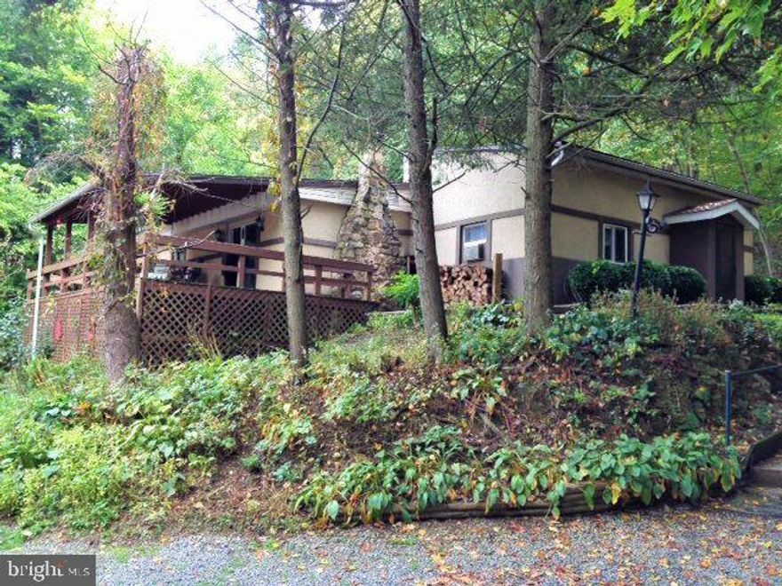 Calling all nature enthusiasts, hunters, or those that love peace and quiet! This 3 bed, 1 bath rancher sits at the end of a secluded wooded lane. Sip coffee and watch the wildlife frolic on the 1,572 ADDITIONAL acres of STATE FOREST directly adjacent to backyard. All one level living with stone fireplace, updated kitchen, laundry room and plenty of storage throughout. Master bedroom has a big walk in closet. Electric in outbuildings and 2 car detached garage with workshop. STATE GAME LANDS and BOAT LAUNCH for the RIVER just 3 miles away!