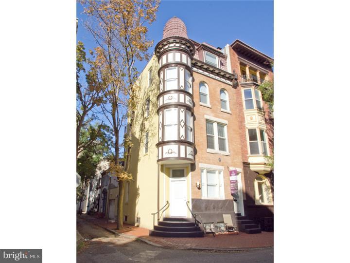 Beautifully renovated and stunning 3 bedroom plus den/office, 2.5 bath home in Washington Square with 1-car garage, hardwood floors, 2 zoned heating and air and approx 4 years left on 10 year tax abatement. Enter on side street into modern kitchen with custom cabinetry and backsplash, terrazzo countertops & stainless steel appliances. Spacious sun-filled open living room and dining room with wood fireplace. Den/office offers electric fireplace and private deck. Master bedroom boasts walk-in closet and modern bathroom with double vanity, walk-in shower and enclosure commode. The top floor offers two bedrooms plus a contemporary bathroom. There is also a large deck with panoramic views of the city. But the best part? There is a large one bedroom rental unit with its own private entrance below - perfect for a considerable steady income! Located in beautiful Washington Square West, convenient to everything! Don't miss!