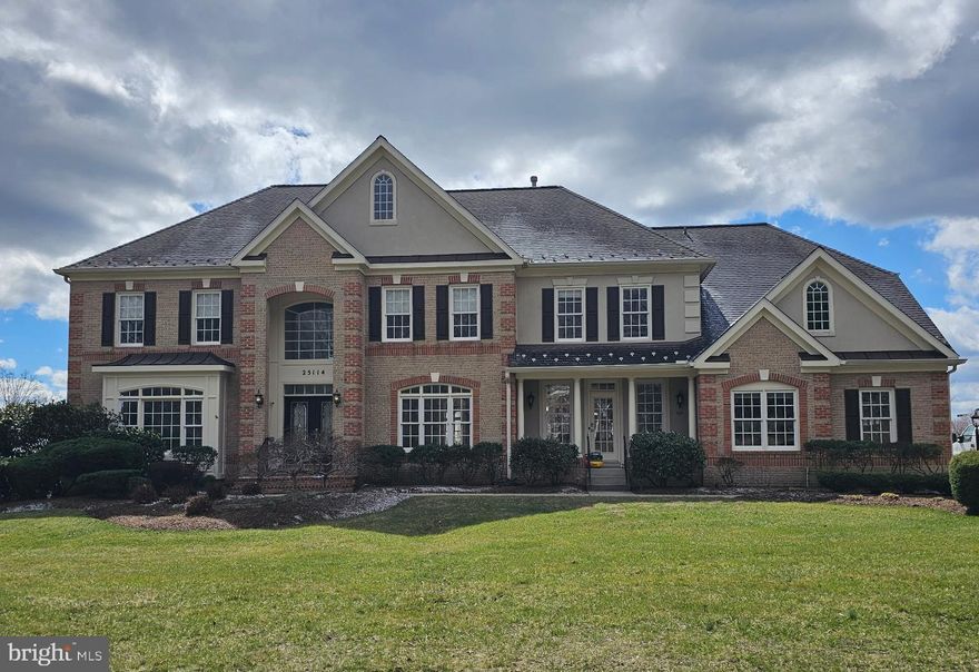 Welcome to 25114 Vista Ridge Road—an extraordinary estate home set on a picturesque 2+ acre lot in the heart of Laytonsville, offering breathtaking panoramic views. This remarkable property combines timeless elegance, modern upgrades, and resort-style outdoor living to create a truly one-of-a-kind offering.    From the moment you arrive, the home’s presence is undeniable, complemented by a spacious three-car side load garage, a driveway with parking for a minimum of 10 cars, and beautifully maintained, mature landscaping and hardscaping.    Step inside to a grand two-story foyer with a sweeping curved staircase that immediately sets the tone. The formal living room and dining room flank the entry, offering refined spaces for entertaining and gatherings.    The home opens onto a stunning two-story great room filled with natural light and anchored by a beautifully designed stone feature wall and fireplace, seamlessly connecting to the gourmet kitchen. The kitchen is both striking and functional, featuring a large center island, quartz countertops, stainless appliances, and abundant cabinetry.  Off the kitchen, you will find an envious pantry, a well-designed mudroom with built-ins (additional washer/dryer availability) and a secondary entrance, plus one of 2 main level powder rooms.  There is a main level office and 2nd powder room that complete this level.  Just off the main living area, step out onto the expansive TimberTech deck with upgraded railing and a waterproof system below—perfect for enjoying the incredible views and extending your living space outdoors.  Upstairs, the primary suite offers a true retreat experience, featuring a walk-in closet with built-ins, an additional custom designed walk in closet/dressing room, and a thoughtfully designed dry bar with a mini refrigerator. The fully remodeled primary bath is spa-inspired, complete with heated floors, a soaking tub, and an oversized walk-in shower. Three additional bedrooms complete the upper level, including one with its own en suite bath and two connected by a Jack and Jill bathroom, in addition to the primary laundry. Beautiful hardwood floors and fresh paint throughout the main and upper levels enhance the home’s refined, move-in-ready appeal.    The walkout lower level adds another dimension of living space, offering a large recreation area with a pool table, an expansive bar/entertainment area with a large island, in addition to a 5th bedroom, and a full bathroom—ideal for guests, extended living, or entertaining and a room perfectly suited as a workout space.  The outdoor space is nothing short of spectacular. Designed for both relaxation and entertaining and featuring a stunning saltwater pool and spa with an in-floor self-cleaning system, a cabana with tiki bar, outdoor grill area, and a fire pit, all surrounded by extensive hardscape and lush landscaping. This private setting creates a true retreat experience right at home.   Beyond its beauty, this home is exceptionally well maintained and thoughtfully upgraded with a focus on efficiency and modern living. Energy improvements include a home energy audit with air sealing and insulation upgrades, along with an owned 8.64 KW solar system. Additional upgrades include a newer roof and water heater, high-efficiency HVAC systems, upgraded front doors, and a fully integrated smart home system controlling lighting, HVAC, and pool features—bringing both comfort and convenience to everyday living.    Located in the scenic countryside of Laytonsville, this home offers the perfect balance of privacy and accessibility. Enjoy peaceful surroundings while remaining within easy reach of Route 108, Route 124, and I-270, with convenient access to Olney, Gaithersburg, and surrounding areas for shopping, dining, and everyday amenities. Nearby parks, golf courses, and equestrian facilities further enhance the lifestyle this location provides.