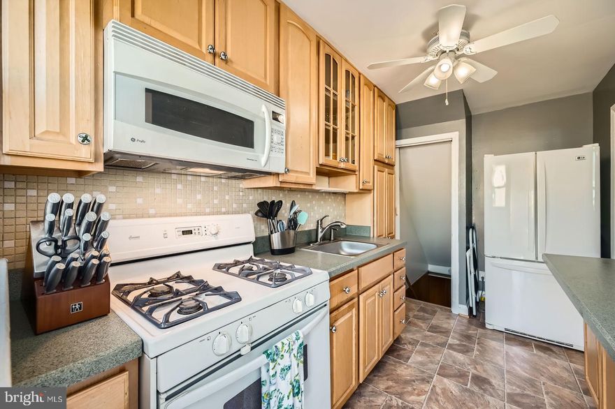 Charming porch front home - - Southbrook Road! Perfect amount of efficient space to call home! Many family memories here - -Traditional floor plan: spacious living room, separate dining room and kitchen are on the main level. Original hardwood flooring underneath the carpet - Kitchen and bathroom (2024) were recently updated-- Newer doors ---  Two spacious bedrooms on the second level and an attic space for more storage. Neutral decor and lots of natural light. Rear patio / parking pad! Full basement has a walkout stair to the yard for a separate entrance. Windows for light in the basement- - The front room is a club space that can function as another bedroom or living area.. there is a laundry, storage/utility area. Central air conditioning -new in October 2023 / New sump pump- March 2024 Washer and dryer also convey. Great location in Dundalk! A beautiful greenspace is at the end of the street - - Ballfields, soccer court  and playground   Shopping and Merritt boulevard are nearby. Easy access to neighboring communities.. Green spaces, state parks and picnic areas as well as waterways for fishing and boating are all nearby!