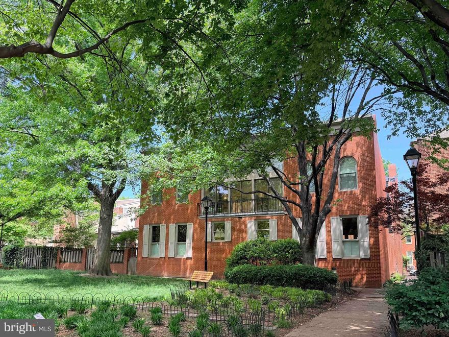 Where architectural individuality and stately shade trees define the neighborhood, this exceptional residence stands apart as one of its most unique offerings. Built in 1980 on the site of a former church, this fully detached single-family home is thoughtfully positioned sideways along the community’s largest park, allowing its entire south-facing façade to capture natural light and serene views of mature trees and open green space. Accessed through a secure, gated courtyard shared by just three residences, offering both privacy and intimacy. For years, the gated courtyard has provided residents’ children and grandchildren with their own secure playground in the heart of the city’s inner harbor.

This home is full of surprises! The front door opens to a dramatic main level designed for both comfort and entertaining. Multiple living and sitting areas are anchored by two wood-burning fireplaces at opposite ends, creating warmth and balance throughout. A fully updated kitchen, an adjoining dining room, a cozy family room, and a powder room complete the main level with both style and functionality.

Upstairs, an open staircase leads to a striking sunroom, where vaulted ceilings and a wall of windows and sliding doors frame elevated, tree-lined views—evoking the quiet charm of a private retreat. The primary suite offers vaulted ceilings, a spacious walk-in closet and a beautifully appointed bath, while two additional bedrooms and a second full bath provide ample accommodations for family or guests.

The home continues to surprise with a generously sized lower level, featuring a large bonus room - ideal for hobbies, storage, or creative pursuits, a laundry area, and a large utility space. French doors on the first floor open to two private patios, providing space for outdoor entertaining.

Often described as Federal Hill’s quieter and more elegant neighbor, Otterbein is a perfect neighborhood for those with an appreciation for beautiful architecture and the multiple pristine parks that host summer concerts, families, and their pups. Otterbein remains a peaceful retreat from the hustle and bustle of commercial business. Due to the historic nature of these handsome residences, many of them do not provide an off-street parking space, however, they do provide beautiful outdoor living spaces free of telephone poles and electric lines. A zero tolerance parking policy is strictly enforced. Up to two registered car decals and 2 guest parking permits are provided to Area 8 residents. You won’t sacrifice convenience to live here. I-95, MARC train, two major league stadiums, shops, Inner Harbor, restaurants, and entertainment are just blocks away.