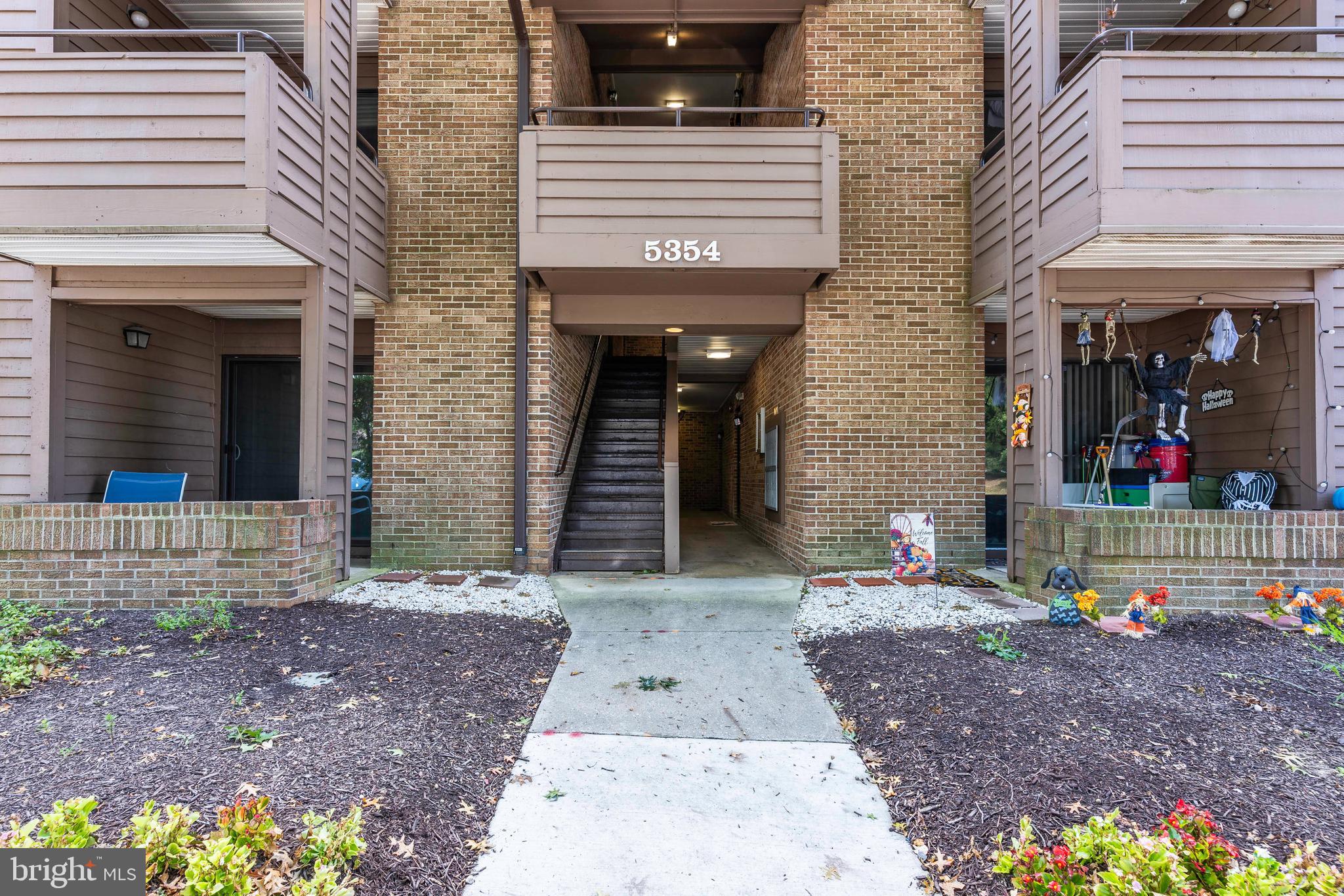 Welcome to 5354 Smooth Meadow Way—a charming ground-level condo nestled in the heart of Columbia’s sought-after Vantage Point neighborhood. This spacious 1-bedroom, 1-bathroom home offers a thoughtful layout, tasteful finishes, and the perfect balance of privacy, comfort, and unbeatable location. Step inside to find luxury vinyl plank flooring throughout, adding warmth and durability to the entire space. You’re welcomed by a foyer with a large coat closet, leading into a bright and airy living room complete with a cozy wood-burning fireplace and a remote-controlled ceiling fan. A new sliding glass door opens to your private patio—ideal for enjoying your morning coffee or relaxing at the end of the day. The kitchen is both stylish and functional, featuring granite countertops, stainless appliances, a breakfast bar, and ample cabinetry. Adjacent to the kitchen, the dedicated dining area includes its own ceiling fan and offers plenty of space for everyday meals or casual entertaining. The generously sized bedroom includes another ceiling fan and large window, while the spacious full bath features updated finishes and neutral tones. You’ll also appreciate the large in-unit laundry/storage room, equipped with new washer and dryer, offering convenience and practicality rarely found in similar condos. Plenty of unassigned parking is available just outside your door, and the community offers endless amenities including lakes, parks, and serene walking paths. Enjoy the best of both worlds with this location—peacefully tucked into the Little Patuxent River watershed area, yet just a short stroll from Downtown Columbia, Lake Kittamaqundi, the Merriweather District, Symphony Woods, the Chrysalis, and Merriweather Post Pavilion. You’ll also enjoy quick access to Rt. 29, I-95, and other major commuter routes. Whether you’re a first-time buyer, downsizing, or looking for an ideal investment property, this condo offers the perfect blend of lifestyle, location, and value. Don’t miss your chance to own in one of Columbia’s most vibrant communities—schedule your showing today!