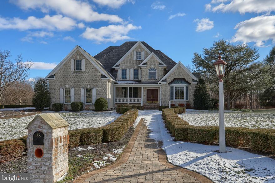 Step into this spectacular home located in Edison Woods and instantly be amazed by all the finishes you would expect in a luxury home. This 7000+ sq ft home is nestled on a 1.82 acre lot on a peaceful cul-de-sac featuring an all brick paver driveway with matching sidewalks. The covered front porch welcomes you into a grand foyer with custom cherry woodwork and crown molding throughout, red oak stairway stained to match, and hardwood floors that lead you to the heart of the home. Enjoy cozy evenings in the family room by the floor to ceiling brick two-sided wood-burning fireplace while watching the seasons change through the wall of windows overlooking the incredible backyard with wooded views. The gourmet kitchen includes an expansive center island w/seating, providing an abundance of granite counter space and storage. The professional-grade Viking stainless steel appliances and sub-zero refrigerator will excite any home chef! Adjacent to the kitchen is a spacious breakfast area featuring a two-sided wood-burning fireplace. First floor Primary Bedroom offers a tray ceiling, crown molding, and primary bath featuring a jetted tub, tiled walk-in shower, walk-in closet, and double vanity. Upstairs you have 4 more Bedrooms with 2 full Jack and Jill baths, bonus room and a balcony overlooking the family room and front entry. Venture down to the fully finished walk out basement to find Italian granite flooring, a second kitchen with granite countertops, dishwasher, microwave, electric range, and sub-zero refrigerator/freezer and family room with another floor to ceiling brick wood-burning fireplace. Full bath, exercise room, 6th bedroom makes this a great hangout spot or in law quarters . Walk out to the screened in porch that leads you to the massive HEATED saltwater pool and attached spa featuring a beautiful waterfall. Other features include an immense wrap around deck, 3 car garage with basement access, central vacuum, 1st floor laundry room with cabinetry and sink. With its luxurious features, prime location, and impeccable craftsmanship, this home is ready to welcome you into a world of comfort.