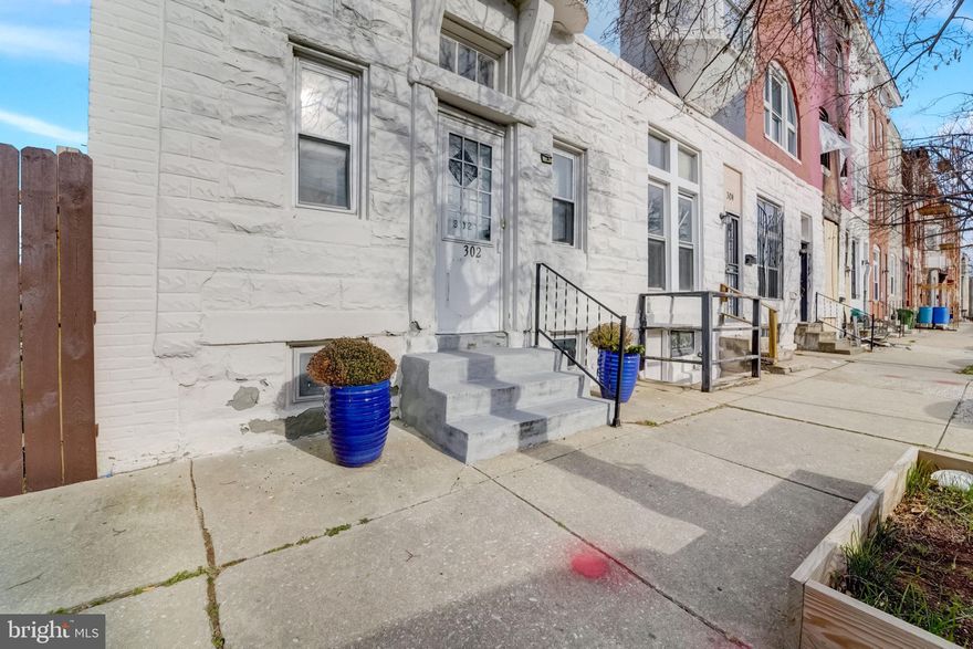 AMAZZING New Price**Oversized End of Group Townhome with  Historic Charm and Modern Updates**EXTRA LOT INCLUDED**3 finished levels of living space featuring an open floor plan, hardwood floors throughout, Large Living room with decorative Fireplace opens to Modern Chef's kitchen w/ breakfast bar, Stainless steel  appliances, & stacked stone backsplash, Table space with 2nd decorative fireplace . Main level laundry room and full bath**Upper Level 1 features 2 large bedrooms,  1 full bath with dual vanity & large soaking tub** Upper level  features the the Primary Suite with full Bath**Fenced side yard (Extra green space lot included) and rear yard! Parking PAD. Perfectly located close to Station North, Penn Station, BPS, Druid Hill Park, & Johns Hopkins University! LNYW Grant Available!!!