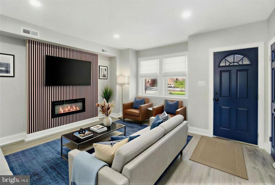 Hurry this one will not last long! This newly renovated spacious townhome features 4 bedrooms and 2.5 bathrooms a fenced backyard, deck and two-car parking pad.  This home is move-in ready showcases new luxury vinyl floors throughout, brand-new kitchen and bathrooms are thoughtfully designed with today’s buyer in mind, featuring quartz countertops, stainless steel appliances and other modern finishes. Enjoy standout features, a custom fireplace accent wall, along with major improvements including new deck, HVAC, plumbing, and electrical systems—offering both style and peace of mind. The fenced backyard, weather-proof deck provides the ideal space for relaxing or entertaining. Perfect for first-time homebuyers, growing families, or investors seeking a turnkey property in Baltimore City. Schedule your private showing today—this fully renovated Baltimore home will not last long!