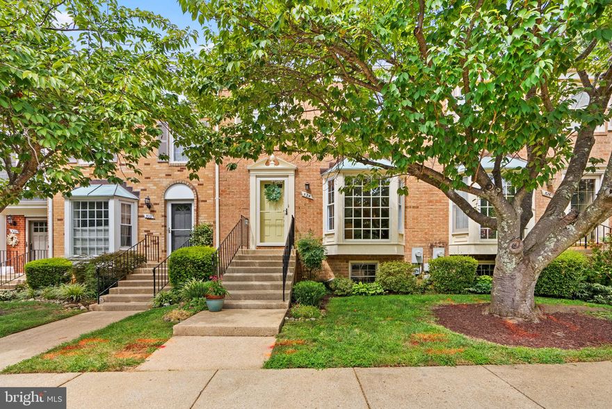 Perfectly-located stately brick townhome in sought-after Bay Hills offers rich hardwoods, loads of natural light, and a front kitchen with stainless steel appliances and gorgeous bay window. The dining room is accented by chair rail trim and a deep tray ceiling. The light-filled living room features a cozy corner brick wood-burning fireplace and access to an elevated deck with wooded views. All bedrooms are on the upper level including an owner’s suite with a fully renovated attached bath boasting a new vanity, “Cabidor” built-ins for additional storage, and a separate shower with trendy ceramics and a built-in shaving ledge and niche. The lower level features a custom built-in reading nook, spacious laundry room, separate workshop, and a large, open rec room with a custom built-in entertainment unit and bookcases, plentiful storage, and NEW French door walkout to a rear patio and tree-lined backyard. Grab your morning coffee at Rise Up, and enjoy easy access to popular restaurants, Green Valley Marketplace, and more! The newly paved Broadneck Peninsula trail is just around the corner and currently runs from Sandy Point, Cape St Claire, and Broadneck Park!
