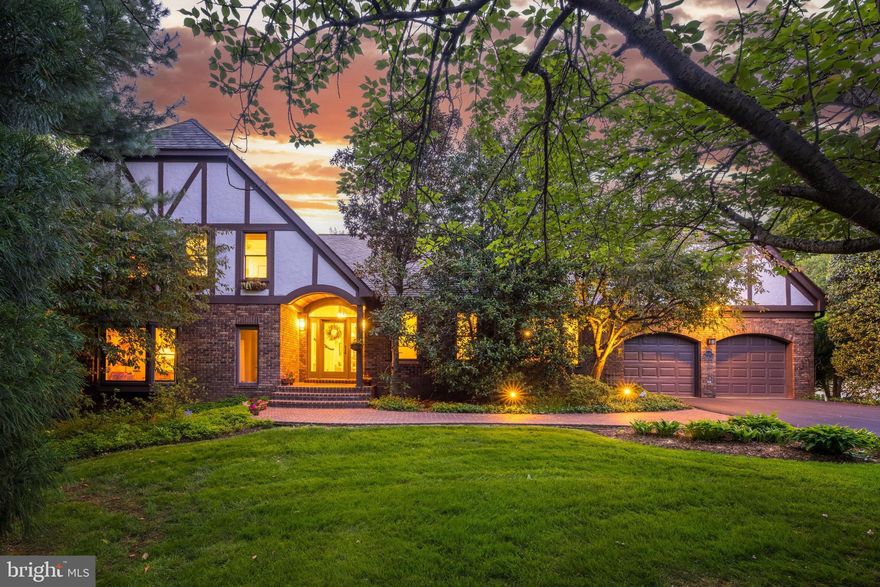 An oasis just minutes from Tysons! This exceptional custom colonial with 6100 sf of living space is privately located on a cul de sac on a spectacular lot surrounded by lush landscaping and backing to parkland.  The original house was thoughtfully expanded with large windows added across the back to bring the outdoors inside and for the owner to enjoy the glorious views from all rooms in the house.  Everywhere you look there is beauty. The main level floor plan is ideal entertaining and has great flow from indoors to outdoors. The vaulted entry was added to complement the Tudor style and takes you into the airy open foyer. The family room, kitchen and great room with walls of windows provide sweeping views of the backyard. The great room/library is an architectural masterpiece that features rich mahogany millwork, floor to ceiling windows, a cathedral ceiling, a bar with sink and a wall of built in bookshelves. The family room was redesigned with a limestone fireplace flanked by custom designed built-ins for a more modern look. The renovated kitchen with a large picture window is a chef's dream with custom cabinetry, Viking stainless steel appliances, separate ice maker, two refreshment drawers and a wine refrigerator in the serving pantry.  There is a second dishwasher and refrigerator in the laundry/mudroom on the main level. The breakfast nook features a built-in custom designed banquette where one can also have informal dinners and enjoy the scenic vistas.  The study is privately tucked away with built-ins and  a large floor to ceiling window to bring the outdoors inside. The owners suite is a retreat with a huge picture window with panoramic views of the backyard and parkland, a luxury bath with an instant hot water heater, spacious walk-in custom closet and dressing area and a cozy sitting room that can be repurposed as an upper level office. The walkout lower level is wheelchair accessible and offers a flexible floor plan that includes a bedroom or office with separate door to the a walkway accessed off the driveway, light filled rec room, second family room with fireplace, a game room , a  wine cellar, and a full bath plus two half baths.  Off the main level there is an expansive deck that leads you to the yard or to the screened porch with cathedral ceiling .  The absolutely breathtaking backyard has extensive accent lighting and uplighting by Vernon Daniels.  The property was landscaped with a variety of flowers, bushes and specimen trees that provide a varying array of colors through spring, summer and fall. The arbor is covered with wisteria and in the summer there is a bountiful bunches of chardonnay grapes hanging from the arbor.  All this plus butterflies and hummingbirds that will be present for your enjoyment. Offer deadline Monday  5/1/23 at 4 pm