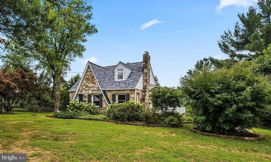 Tudor style Cape with 4 Bedrooms, 2.5 Baths on a .72 acre lot. This home has an open floor plan on the main level which is great for entertaining. Kitchen has granite counters, SS appliances, tons of storage. The Living Room has a wood burning fireplace. Spacious Dining Room with French doors leading out to the Sun Room. Two bedrooms on the main level and Hall Bath with a lux shower. Upstairs has two more Bedrooms & Hall Bath. The lower level has laundry, a workshop and access to the original  built-in garage  now used for storage. Outdoor living space consists of a huge Trex deck with built-in grill , oversized shed and side patio. The yard is completely fenced plus a large parking pad.  An Absolute Charmer!!!