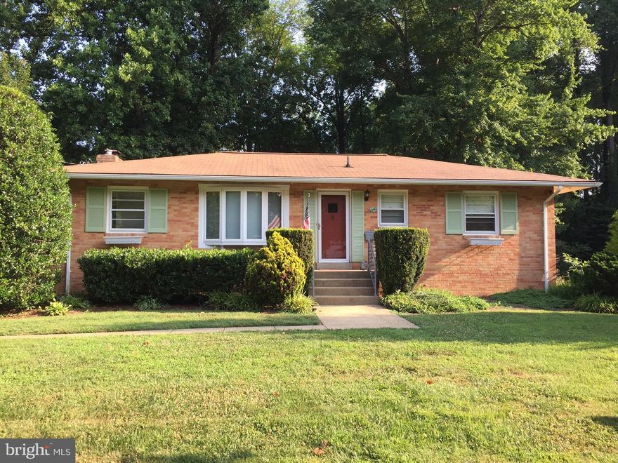 VIENNA OPPORTUNITY!   Make this Happy Home Yours!!  Wonderful, old-time quality-built, 4BR brick rambler on quiet street,  just steps to Vienna Metro and Marshall Road ES.  Lovely original hardwood floors on main level.  Kitchen with Silestone counters, 42" cabinets and spacious eat-in area leading to a  fabulous,  light-filled family room addition--- with  cathedral  hardwood ceiling, 4 skylights with Velux shades and sliding glass door to deck, overlooking beautiful, huge and fully fenced back yard.  Downstairs, the daylight/walk-out basement features a large rec room with classic knotty pine paneling, plus a bedroom and an extra room which  can be used as a 5th bedroom.  Full bath was renovated in 2021.   Plenty of storage:  lots of shelves in utility room & adjoining unfinished area..PLUS a giant garage-type storage area beneath the family room addition.  Gorgeous 0.4 acre lot backs to trees &  remote elementary school property.   VAC Pool membership can convey with house....avoid the wait list.   Madison HS. Two minutes to I-66, five minutes to Beltway.  No HOA.  No Vienna taxes.  Opportunity and options:  move right in and enjoy!!....maybe renovate....maybe expand....or maybe re-build... someday!