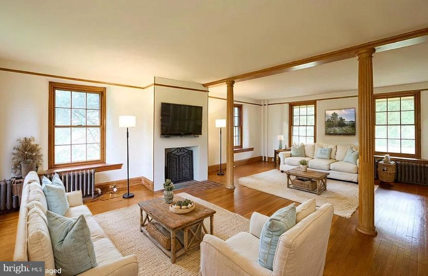 The original Darlington house (Darlington street in West Chester), built in 1761 and thoughtfully refined in 1950 and 1997, this classic stone farmhouse perfectly balances the gravity of history with the grace of modern comfort. Originally a land grant to the Darlingtons from William Penn, only two families have owned this property. Inside, the home unfolds with grand-scale rooms featuring original hardwoods and woodwork. The current 6-bedroom layout offers incredible flexibility, including a sprawling primary suite that could easily be re-imagined into four separate bedrooms—creating a 9-bedroom home for the ultimate family compound or guest retreat. The modern kitchen is warm and welcoming, with freshly refinished floors, beautiful wood cabinets, skylights and banks of windows in the dining area. Heritage details abound from the authentic root cellar, intricate metalwork on the doors and exterior lights, two fireplaces, original doors and windows, original pocket doors in the primary suite, oiled woodwork, and deep-set windows. Plus modern amenities like pure drinking water provided by a dedicated distiller, central air (high velocity system), all public utilities, and a metal roof that was installed in March of this year. 

The grounds provide the backbone to create your dream garden. Just off the kitchen is a matching historic stone smokehouse leading to stone walls draped in fragrant wisteria.  Make this your sanctuary featuring a mini orchard of apple, cherry, plum, fig, and native paw paw trees. Perhaps the most intriguing feature is the original ice house foundation—a 20-foot diameter and deep circular stone well that serves as a stunning architectural focal point. This could be incorporated into a redesign of that portion of the property as the driveway could be moved to Raspberry Lane. All of this just outside West Chester borough, a quick hop to dining, entertainment, and shopping and an easy drive into Philadelphia or Wilmington.

For those seeking a true multi-generational estate, a second residence on the adjoining parcel is available exclusively with the main home for an additional $750,000. 525 Raspberry Lane is a 2,400 SF 3 bedroom/2 bath carriage house  featuring a soaring great room with vaulted ceilings, exposed beams,  a massive three-season room, fenced-in yard, and gorgeous gardens. This house is currently rented, please do not disturb tenants.  Pictures with furniture are virtually staged which may have altered room features.Please note that half of the fenced in yard for 525 Raspberry lane is part of this property, the fence can be moved to the correct property line before settlement.