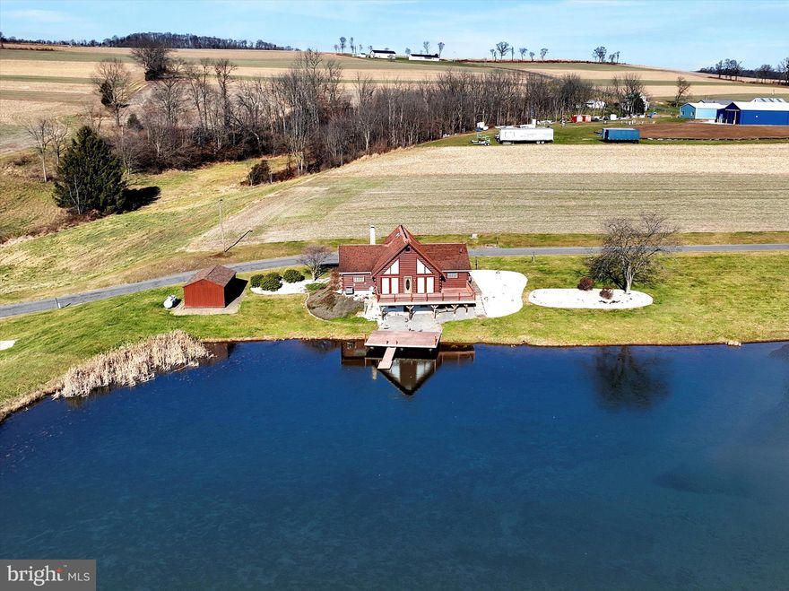 Wow wow wow! Check out this extremely rare opportunity to own your very own slice of heaven! Pristine log home situated on almost 22 rolling acres overlooking its very own pond and stocked with Koi fish as long as your arm! Imagine waking up and enjoying your morning coffee on the 497 sq. ft. composite deck taking in all of nature's beauty and tranquility. The home features 1 Bed/1 Bath, Kitchen with ample counter/cabinet space, appliances included, open concept Living/Dining Area with cathedral ceilings, and interior access to Laundry Area (washer/dryer included) located in 1-car attached Garage. There is a full basement with walkout just waiting to be finished for additional living space. Oak, pine, and maple adorn the interior of this rustic retreat while the window placement allows for an abundance of natural light. Propane heat (newer furnace), supplemental coal stove with hand-crafted river stone chimney, central air, onsite septic, private water, and 200 amp electric service. Parking is no problem with the circular black top driveway, 1-car detached garage/shed in addition to the attached garage, and a concrete slab below which would be perfect for trailers, travel trailer, tractors, etc. If you're looking for a lovingly maintained home or second home that provides peace and distance from all of life's hustle and bustle, you truly need to experience this property for yourself.  Showings start 1/5/24. Schedule yours today!