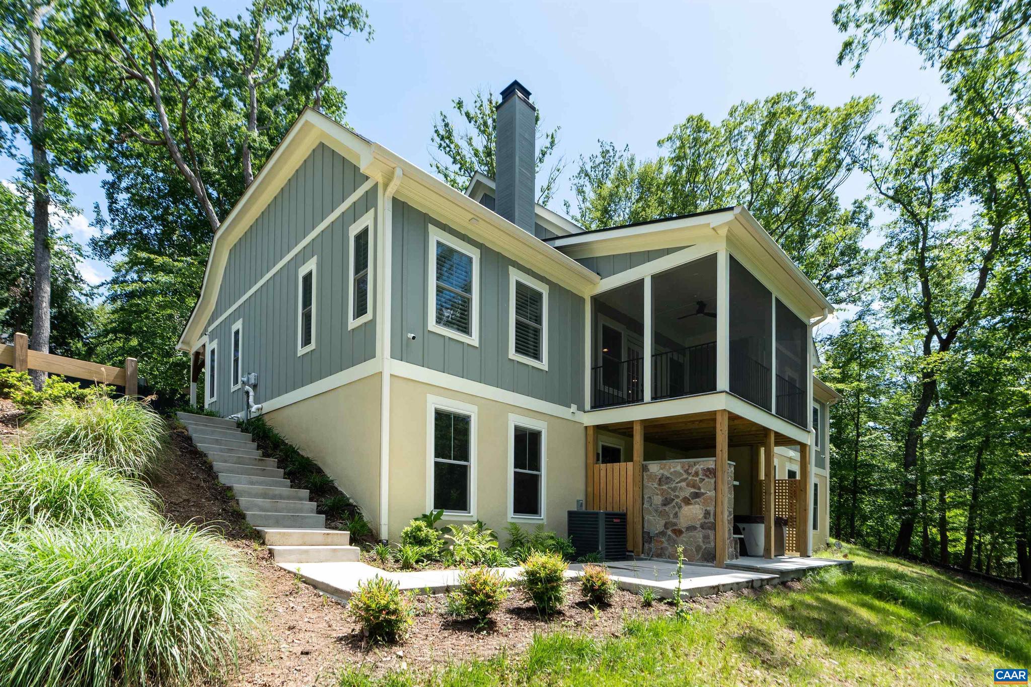 Experience refined living in this exceptional custom-built 2024 home located in the desirable Carrsbrook community. Set on 1.51 acres of serene, wooded landscape, this thoughtfully designed residence offers 5 bedrooms and 4.5 baths. Enjoy the ease of main-level living featuring rich hardwood floors, a stunning designer kitchen, and an open-concept living area centered around a cozy fireplace. Step on to the screened porch to take in peaceful wooded views. The elegant primary suite boasts a spa-inspired bathroom, creating a true private retreat. The fully finished walkout terrace level provides additional versatile space, including two rooms ideal for a home office, gym, or media room. Entertain outdoors on the patio with a built-in stone fireplace and hot tub.Conveniently located just minutes from UVA, Downtown Charlottesville, dining and shopping.,Quartz Counter,White Cabinets,Fireplace in Living Room