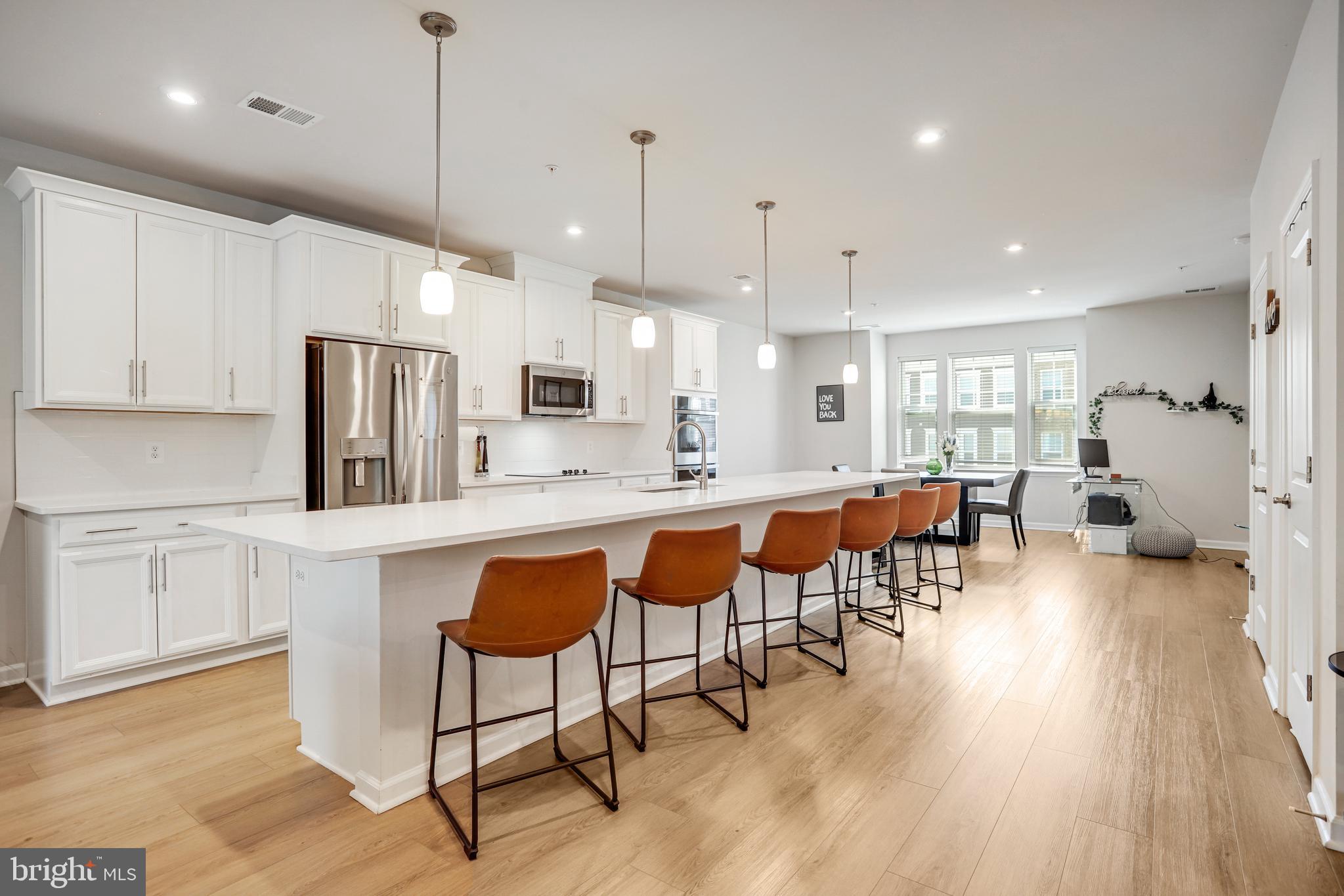 This home is eligible for a grant up to $8,000 and a rate as low as 5% with Annie Mac mortgage. Details attached.*** Up to $15,000 in credit available on this home!**** Welcome to this stunning 3-bedroom, 2.5-bathroom townhome, located at 10548 John Glenn St, Lanham, MD. This modern home boasts architectural elements including built-ins, a custom walk-in closet, high ceilings, and a private entrance, providing a sense of elegance and exclusivity with townhome-like living.
Step inside to discover an open chef's kitchen featuring a cooktop, dishwasher, double oven, energy star appliances, an expansive 18 foot island, and quartz countertops perfect for culinary enthusiasts and entertainers alike. The open kitchen design seamlessly flows into the dining area, creating an inviting space for entertaining or enjoying family meals.
The living area features custom built-ins with a fireplace, adding warmth and charm to the home. The primary ensuite bathroom offers luxury and convenience with double sinks, a separate shower, and separate vanities. Custom closets and a walk-in closet provide ample storage space, ensuring organization and functionality.
This condo also offers the convenience of an attached garage, providing secure parking for your vehicles.
Located in a desirable area, this condo is the epitome of sophisticated living. Don't miss the opportunity to make this exquisite property your new home. Schedule a showing today and experience the luxury and comfort that this condo has to offer.