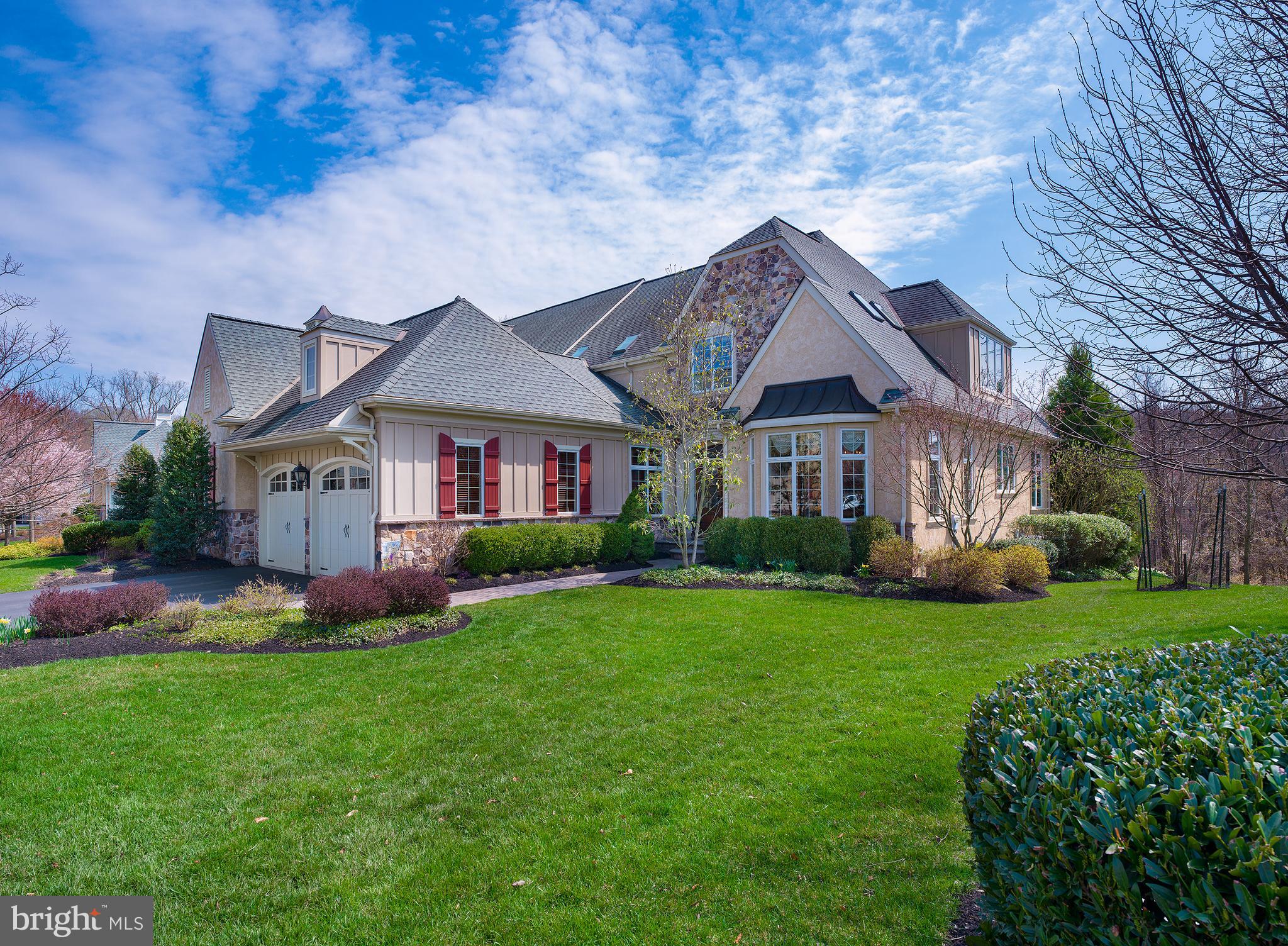 Carefree elegant living is yours at the premier Haverford Reserve community in the heart of Main Line. This gorgeous stone and stucco home with a striking European-style exterior is set amidst 124 acres of preserved parkland, with rolling hills, streams, mature trees, hiking trails, and 45 acres of recreational areas to enjoy. Quality built by The Goldenberg Group and Guidi Homes, 226 Valley Ridge Road is a luxury residence in a dream location, featuring top-grade fit and finishes, Anderson windows, and refined details throughout. A 2-car attached garage and separate detached garage (perfect for your sports car!) are also on hand for keeping your vehicles safe from the elements. Inside, a grand foyer with hardwood floors and sweeping staircase makes a welcoming impression and leads to generously-sized rooms for your living and entertaining pleasure. Airy 9+ foot ceilings, beautiful moldings and millwork, arched openings, and oversized light-filled windows enhance the ambience. Host in style in the gracious dining room with tray ceiling and bay window, perfect for gatherings, family meals & celebrations. Adjacent is a spectacular cooks kitchen appointed with top-of-the-line Wolf, Sub-Zero & Miele appliances, abundant custom cabinetry, granite countertops, and a large center island with storage & seating. Chat over morning coffee and serve casual fare in the lovely open breakfast area. Comfortable and inviting, the family room is great for movie nights and relaxing. It features a vaulted ceiling, gas fireplace to cozy around, and sets of glass-paneled doors leading out to the peaceful deck with scenic views for BBQs and dining alfresco. This level also has a wainscoted office with built-ins for working remotely, a tasteful guest powder room, private primary bedroom suite with a custom-outfitted walk-in closet and spa bath, plus a full laundry room accessing the garage. Upstairs presents an open landing with built-ins & room for seating, 2 spacious bedrooms sharing a Jack & Jill bath, and 4th bedroom with sitting area, walk-in closet and en-suite bath. Hang out and party on the finished lower level complete with a game room, full wet bar, extensive wine cellar, 2nd family room with coffered ceilings & gas stone fireplace, even a playroom for the kids. There is also an exercise room for keeping fit, a full bathroom, lots of storage, and a walkout to the paver patio. Welcome home!