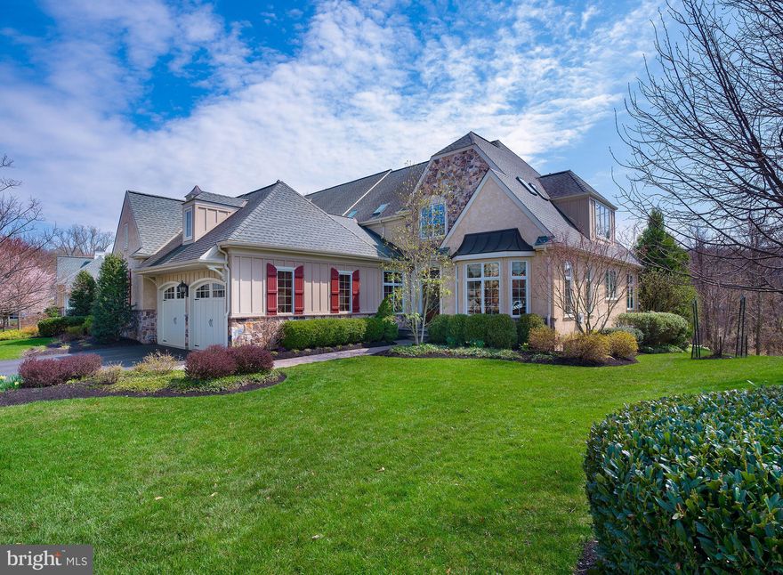 Carefree elegant living is yours at the premier Haverford Reserve community in the heart of Main Line. This gorgeous stone and stucco home with a striking European-style exterior is set amidst 124 acres of preserved parkland, with rolling hills, streams, mature trees, hiking trails, and 45 acres of recreational areas to enjoy. Quality built by The Goldenberg Group and Guidi Homes, 226 Valley Ridge Road is a luxury residence in a dream location, featuring top-grade fit and finishes, Anderson windows, and refined details throughout. A 2-car attached garage and separate detached garage (perfect for your sports car!) are also on hand for keeping your vehicles safe from the elements.   Inside, a grand foyer with hardwood floors and sweeping staircase makes a welcoming impression and leads to generously-sized rooms for your living and entertaining pleasure. Airy 9+ foot ceilings, beautiful moldings and millwork, arched openings, and oversized light-filled windows enhance the ambience. Host in style in the gracious dining room with tray ceiling and bay window, perfect for gatherings, family meals & celebrations. Adjacent is a spectacular cooks kitchen appointed with top-of-the-line Wolf, Sub-Zero & Miele appliances, abundant custom cabinetry, granite countertops, and a large center island with storage & seating. Chat over morning coffee and serve casual fare in the lovely open breakfast area.   Comfortable and inviting, the family room is great for movie nights and relaxing. It features a vaulted ceiling, gas fireplace to cozy around, and sets of glass-paneled doors leading out to the peaceful deck with scenic views for BBQs and dining alfresco. This level also has a wainscoted office with built-ins for working remotely, a tasteful guest powder room, private primary bedroom suite with a custom-outfitted walk-in closet and spa bath, plus a full laundry room accessing the garage.  Upstairs presents an open landing with built-ins & room for seating, 2 spacious bedrooms sharing a Jack & Jill bath, and 4th bedroom with sitting area, walk-in closet and en-suite bath. Hang out and party on the finished lower level complete with a game room, full wet bar, extensive wine cellar, 2nd family room with coffered ceilings & gas stone fireplace, even a playroom for the kids. There is also an exercise room for keeping fit, a full bathroom, lots of storage, and a walkout to the paver patio. Welcome home!