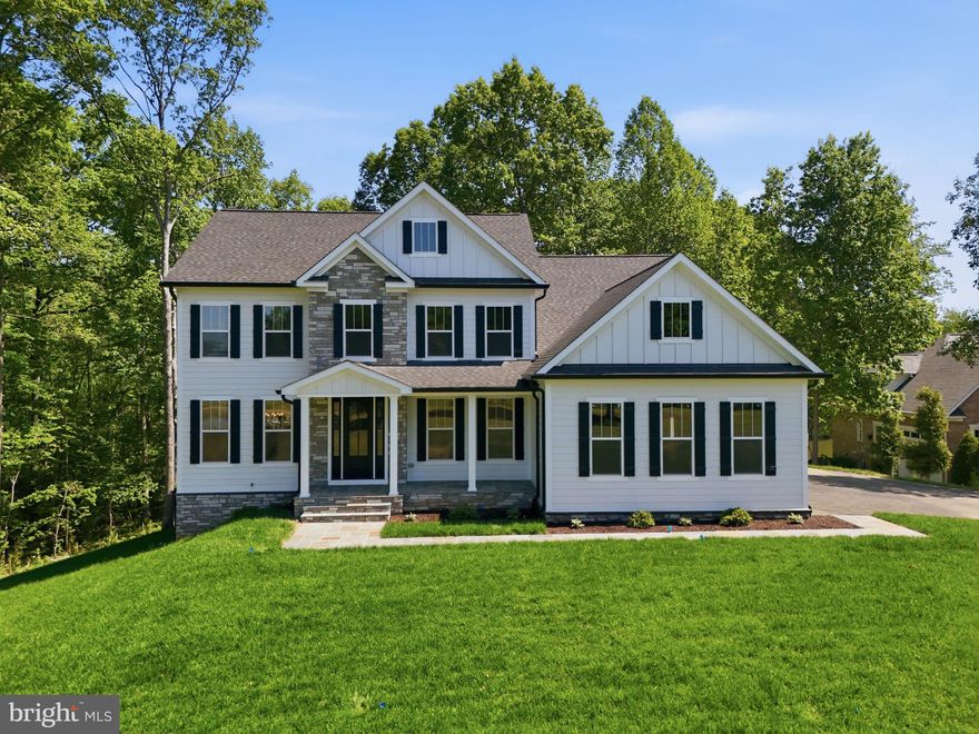 A brand new Waterfront Dream Home ​anchored inside the gated resort community of Fawn Lake​, one of the most sought-after addresses in the Fredericksburg area!  
​This Gorgeous Modern Coastal Colonial by Foundation Homes​ offering​ nearly 6,000 sq. ft​, is perfectly nestled ​on a wooded Acre with park-like grounds​, ​providing privacy, tranquility and breathtaking lake views​!   

The Ava Grace model offers ​main level living and a flowing seamless interior designed with gorgeous modern details, large windows, upgraded finishes at every turn, and wood flooring throughout the main level.​ Whether you're looking for a year-round residence or a charming vacation getaway, this Dream Lake Home offers the ultimate waterfront lifestyle you have been dreaming of!

Immersed in privacy, this future lakefront retreat, complete with a boat dock is tucked in a small cove, offering an idyllic setting with endless options for lakeside fun, relaxing and adventure. Imagine kayaking, fishing, paddleboarding and swimming only steps from your back door.   
​Sited next to a wooded conservation area, at the end of a cul-de-sac with a meandering driveway leading to a welcoming Front Porch​ overlooking a beautiful pond with a majestic fountain, right in the heart of Fawn Lake!  
​Step inside to an elegant Foyer flanked by a private Study showcased by glass French doors on one side and a formal Dining Room on the other. The spectacular two story Great Room with soaring cathedral ceiling, features a stunning stone fireplace, and a wall of floor to ceiling windows overlooking the scenic backyard and the lake just beyond. An amazing Gourmet Chef's Kitchen features top of the line stainless steel appliances, upgraded soft-close cabinetry in your favorite color, topped with your choice of Quartz or Granite, and tile backsplash! A convenient Butler's Pantry with built-in wine rack, and beverage fridge makes entertaining a breeze! Surface mounted and pendant lighting over the counters is included. Enjoy casual dining at the breakfast bar or dining space with access doors to the inviting Screened Porch. Retreat to the Main Level Primary Bedroom Suite, well appointed with two walk in closets and a fabulous Spa Bath offering separate vanities, a soaking tub and tiled shower. Completing the Main Level is a convenient Laundry Room with utility sink and a nice half bath for guests. The staircase leads to a spacious multi purpose Loft area on the upper level overlooking the Great Room below.  A private en-suite with walk-in closet,  plus 3 gracious Bedrooms sharing  2 full Baths with double vanities and separate bathing areas complete this level.

Designed for entertaining, the finished walk-out basement offers an expansive Recreation Room, gym, a gracious Bedroom with adjoining full bath, and plenty of storage space.  
The 3-Car Garage ​offers ample​ parking space for vehicles and even your boat!

​This ​waterfront Dream Home provides the perfect harmony of indoor and outdoor living  for the ultimate lakeside lifestyle and a tranquil feeling that will leave you breathless​!

The Fawn Lake Community offers amazing amenities such as a boating recreational lake, beach, an Arnold Palmer designed Golf Course, tennis courts, baseball and soccer fields, dog park, volleyball courts, walking trails, Community Club House, marina, fitness center, restaurants, Country Club, playgrounds, and so much more! Located in the countryside near Fredericksburg, VA surrounded by parklands.  Conveniently located to shopping, restaurants, top-rated Riverbend District schools and I-95!