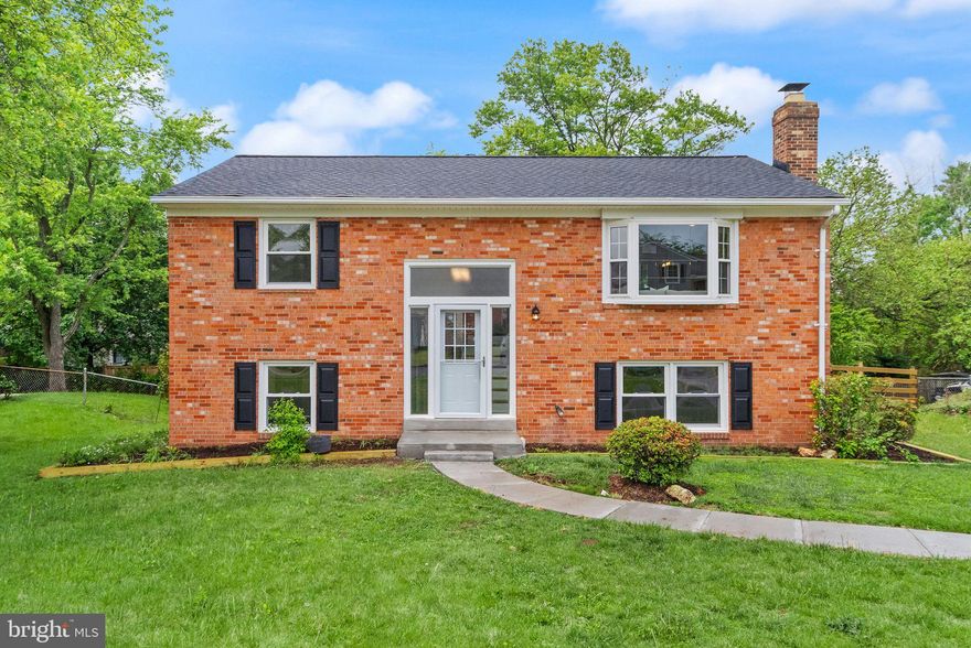 Nestled on a quiet street in sought-after Chantilly, 4010 Mapleton Drive is a thoughtfully renovated 4-bedroom, 2-bathroom split-level home blending classic charm with modern comfort. From the moment you step inside, you'll be impressed by the inviting upper-level living room, highlighted by gleaming refinished hardwood floors and a large bay window that floods the space with natural light. The updated eat-in kitchen is a chef’s dream, featuring new cabinetry, new quartz countertops, new stainless steel appliances, and a functional island offering additional storage and prep space. Adjacent to the kitchen, enjoy meals in the dedicated dining area or unwind on the enclosed sleeping porch, perfect for relaxing while overlooking the backyard. The upper level also hosts the serene primary bedroom with generous closet space, a cozy secondary bedroom, and a fully renovated hallway bathroom with a sleek shower/tub combo. Downstairs, the fully renovated lower level features brand-new luxury vinyl plank flooring throughout and offers incredible versatility. The spacious L-shaped recreation room is anchored by a stylish brick wood-burning fireplace, with a natural flex space off to the side—perfect for a home office, play area, or reading nook. This level also includes two additional bedrooms, a second fully renovated full bath, a large utility room, and an oversized storage area that can easily function as a workshop, craft space, or extra storage. Venture out to the expansive, fully fenced backyard where the lush, well-maintained lawn offers a blank canvas to plant trees or flower beds. Additional highlights include a brand-new roof (2025), newer heat pump (2024), and newer water heater (2024). Tucked away in a quiet, established neighborhood, this home offers easy access to US-50 and is just minutes from shopping, dining, and entertainment options. Move-in ready with room to grow—this is the perfect place to call home. Schedule your showing today!