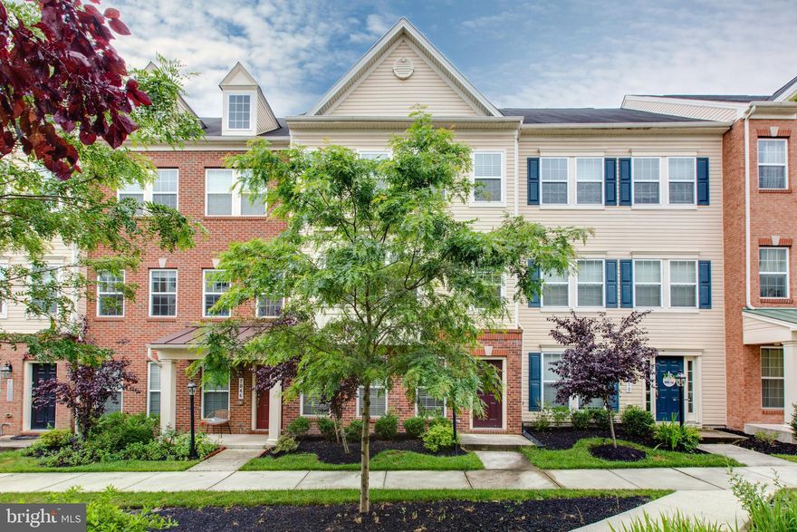 Welcome to 7048 Foxton Way, located in the highly sought-after Oxford Square community! This beautifully designed brick-front townhome with a 2-car garage offers four finished levels of stylish and functional living space. From the moment you step inside, you’ll be greeted by an abundance of natural light that fills the home. The entry level features convenient rear garage access and a full bathroom, making it perfect as a guest suite, home office, or drop zone. On the main level, enjoy a fully upgraded gourmet kitchen with a large island, ample cabinetry, and modern finishes—ideal for both everyday living and entertaining. Upstairs, you’ll find three spacious bedrooms and two full bathrooms, including a serene primary suite with spa-like features. The finished loft level opens to a private rooftop balcony, offering a peaceful retreat or the perfect space for entertaining guests. Conveniently located just minutes from major highways, Fort Meade, BWI Airport, and shopping centers, this home perfectly blends luxury, comfort, and convenience.