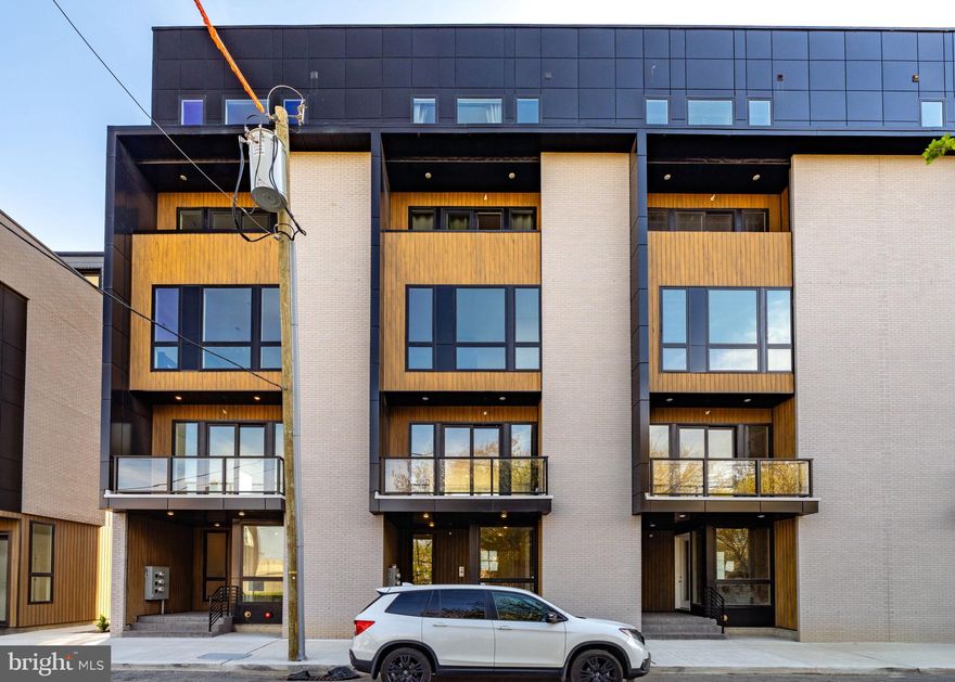 LIMITED TIME SPECIAL PRICING!! Discover modern city living in Somerset Square, a vibrant new community featuring 23 townhomes and 52 stacked condos, perfectly situated just two blocks from Fishtown and two blocks to Aramingo Ave. With rapid development transforming the area, now is the time to invest in this thriving neighborhood. Buyers have options for finishes and upgrades to customize to their tastes and they can choose between dark or light colored cabinets. This exquisite upper level condo is designed for modern living, featuring a rear-loading garage with 1 car parking. The main floor has the chef’s kitchen completed with quartz countertops, your choice of dark or light flat pannel canets, stainless steel appliances and under countertop microwave,  and a large island for entertaining. There is a spacious living and dining area, with optional upgraded fireplace, and a convenient half bath. The oversized windows allow maximum natural light in, and the large sliding doors lead to your private balcony. Upstairs includes three bedrooms, and a guest hall bathroom. The primary suite has a luxurious spa like en-suite bath with duel sink floating vanity, and ample closet space. Assend one more level to your large private roof deck to enjoy the evenings.   Additional features include optional upgrade to includes a private elevator that opens direct to your unit. This community will has low HOA fees & condo fees that cover snow removal & landscaping in common areas,10 year tax abatement and 1 year builders warranty. Ask about out the additional $1,525 savings that you could save by using our preferred lender.