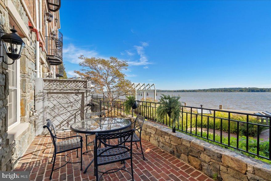 Improved Price and AWE-INSPIRING VISTA.....Turn Key Quality! CHOICE WATERFRONT RESIDENCE in Old Town Alexandria as you've been hoping to discover! It is infrequent to find this location and quality- a classic Colonial with open, light-filled floor plan for your 2023 lifestyle! With four large bedrooms this home's interior has been restored and curated with absolute premium fit and finish throughout.  High ceilings, hand-cut crown molding, gleaming hardwood floors throughout, gas fireplaces, and solid hard wood doors begin the list of upgrades implemented inthis exceptional transformation. The oversized kitchen has enormous storage capability and glass cabinets. Its polished marble countertops are opulent and the premier appliances make this decorative and functional. The main level floorplan has appreciable entertaining space and a tucked away powder room. The next level features the primary suite with a sitting area, gas fireplace, walk in closets and a dual sink marble bath with shower and soaking tub. Also on this level is a second bedroom, fashionable marble full bath and laundry area. On the upper level are two nicely appointed bedrooms and a chic marble bath. The entry level with two car garage features a gas fireplace, powder room, wet bar and walk out access to the brick patio- all elevated for front row seat perspective of waterfront activity whether it’s sunrise crewing or sunset sailing. The phenomenal water views from all levels and private setting are distinctive features in this opulent locality. Featuring easy walkable access to all that defines why BEST PLACES ranked Alexandria # Two and CONDE NAST has also placed Old Town as # Two of the best small cities in America! Six miles to National Landing, five miles to DCA and eight miles to our Nation's Capital!