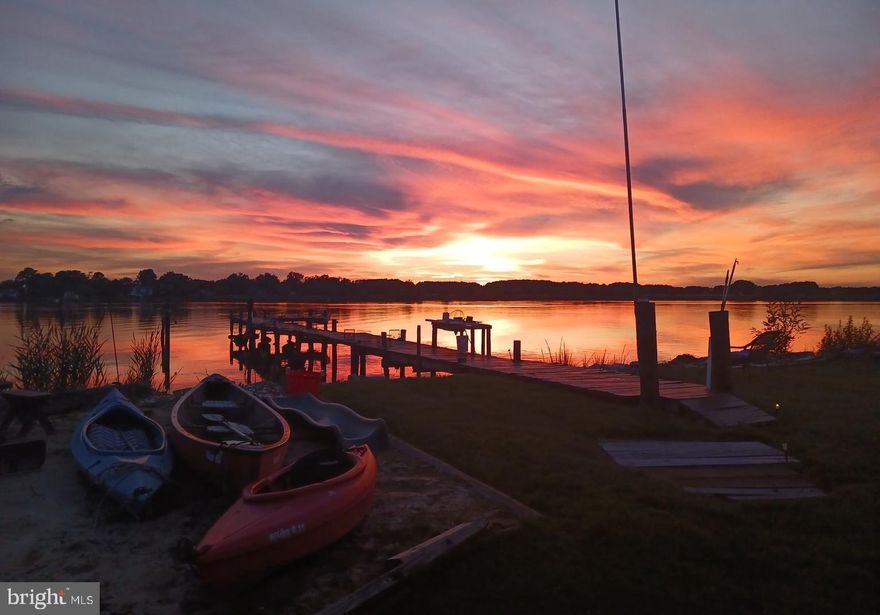 Great value - this home is in move in condition.  You can start enjoying your slice of Paradise immediately.  Price has been reduced  on this awesome waterfront with one of the best sunset views in Tilghman.  Property is in and estate and Owners are sadly ready to let this sweet property go. Welcome home to your own little bit of paradise.   Three bedrooms,  eat in kitchen, dining room or den, and spacious living room. Perfect screened in waterside porch where you can sit and enjoy the tranquility of Tilghman Island with your morning coffee or afternoon/evening adult beverage.  Watch the sunsets in the evening from your cozy patio,  or front deck - after a relaxing day on the water, fishing or crabbing from your private dock.   With over 3 acres this property offers lots of possibilities.  There is a new BAT septic system rated for 4 bedrooms, an updated well.  Original hardwood flooring brought in by Skipjack from Virginia.  The main entrance is located on the water side  of this Classic  Eastern Shore home, as the main mode of travel was by water with stained glass installed by the original owner in 1900.