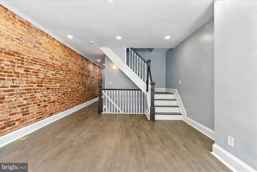 WOW!! BUY this REMARKABLE Renovation TODAY! AFFORDABLE LUXURY!!! This is what you've been waiting for! Start the next phase of your life with enough space for your entire family! The rest of your life starts with this home and it’s OPEN Floor plan designed for entertaining, beautiful exposed brick walls , custom wood floors installed to impress everyone, GOURMET KITCHEN with stunning granite countertops, stylish Bathrooms, a finished lower level with a bedroom & family room,  and SPACIOUS BEDROOMS with a master ensuite. Don’t hesitate to make this house your home.  Be sure to take advantage of the JHU Live Near Your Work Grant of $17,000. BUYERS MAY ALSO QUALIFY FOR A LENDER SPECIFIC GRANT WITH FUNDS UP TO $$6,000. Other FUNDS may be available to stack as well! Don't miss this phenomenal home . Find out if you qualify TODAY!