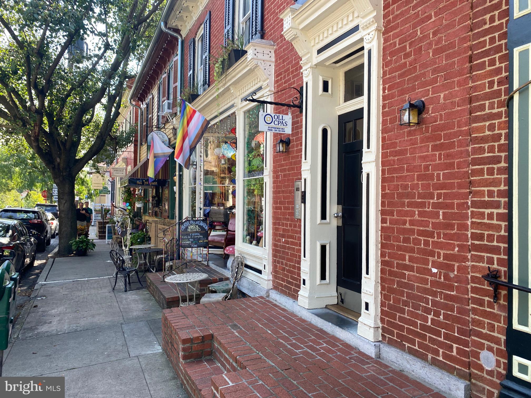 Small 2nd floor office with windows overlooking German Street.
Perfect for the working adult professional looking for a small, quiet, private down town office space.
Enjoy the sights and sounds of Downtown Shepherdstown from your desk.
Rent Includes: Electric, Water, Sewer, Garbage & Parking for 1 car.
Reserved Parking Space for 1 small vehicle in rear parking lot.
Small bathroom/sink in unit.
Code/Intercom Entry.
$650/mo. covers everything excluding internet. Tenant must pay for own Wi-Fi. Owner will cover costs of wiring to unit.
Lease terms/lengths negotiable.
Tenant must apply thru town for sign on building. Owner will sign forms for authorization. Exterior and interior signs done at tenants expense/owner approval.
Two doors down from Lost Dog Cafe and next to the Mechlenburg Inn!