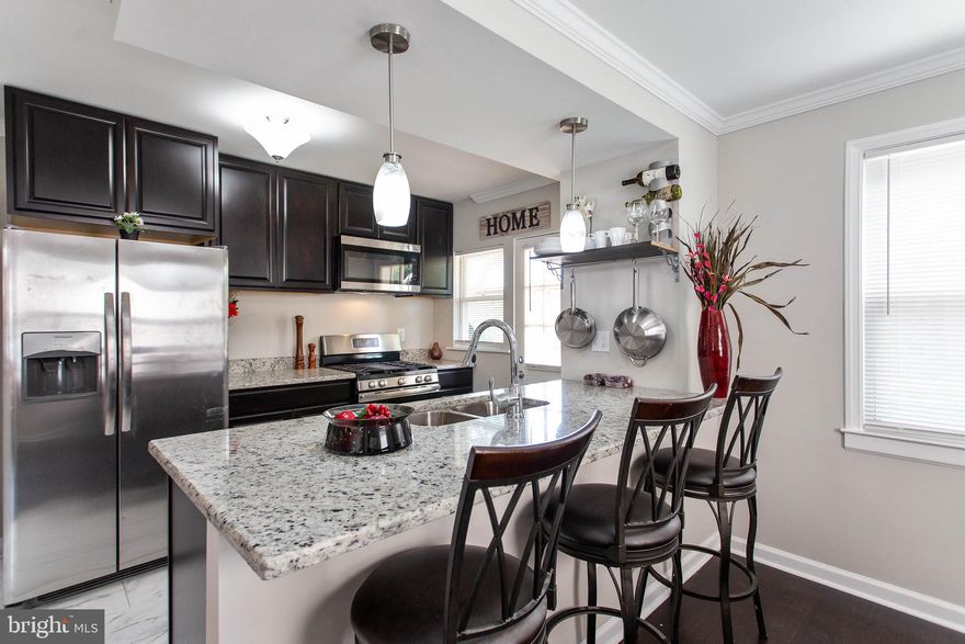 CJB is back with another "Hot Home" in 21239. Come check out this end of group townhome located in one of the most sought after zip codes in the city. Over 1600 SF of finished space, This open concept has contemporary design with a warm at home feel. The brand new kitchen is designed with the chef of the house in mind and the finished lower level has room for conversation and entertaining. There is a huge back yard, and the upper level has 3 full bedrooms and a custom master bath. The wait is over. Welcome Home.